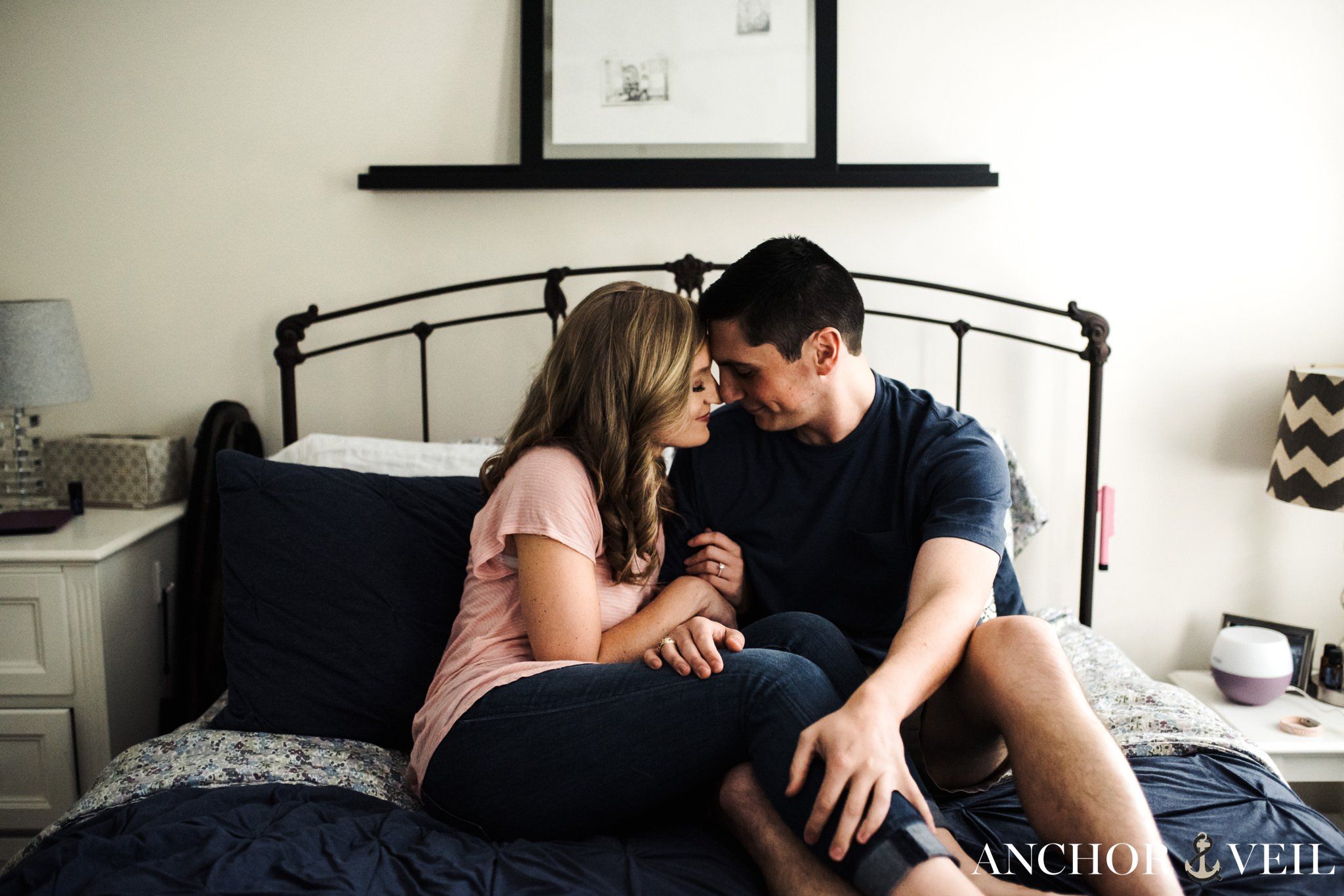cuddled on the bed during the In Home Charlotte Engagement Session