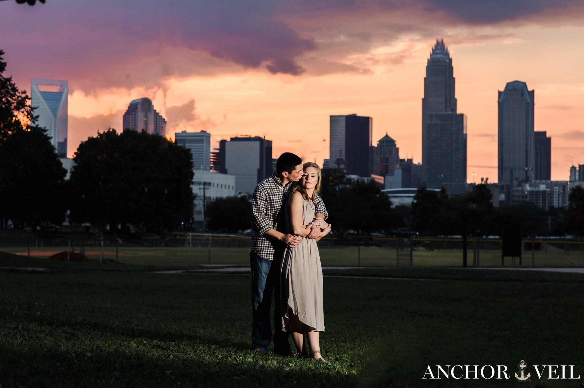 uptown charlotte skyline during the engagement session