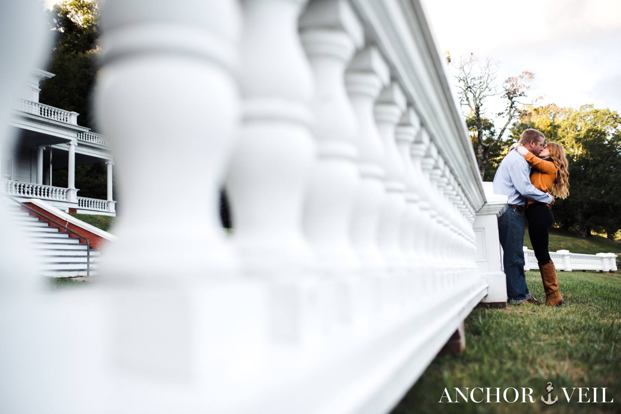 A tender Lovers embrace at Moses Cove Manor in Boone for their engagement session