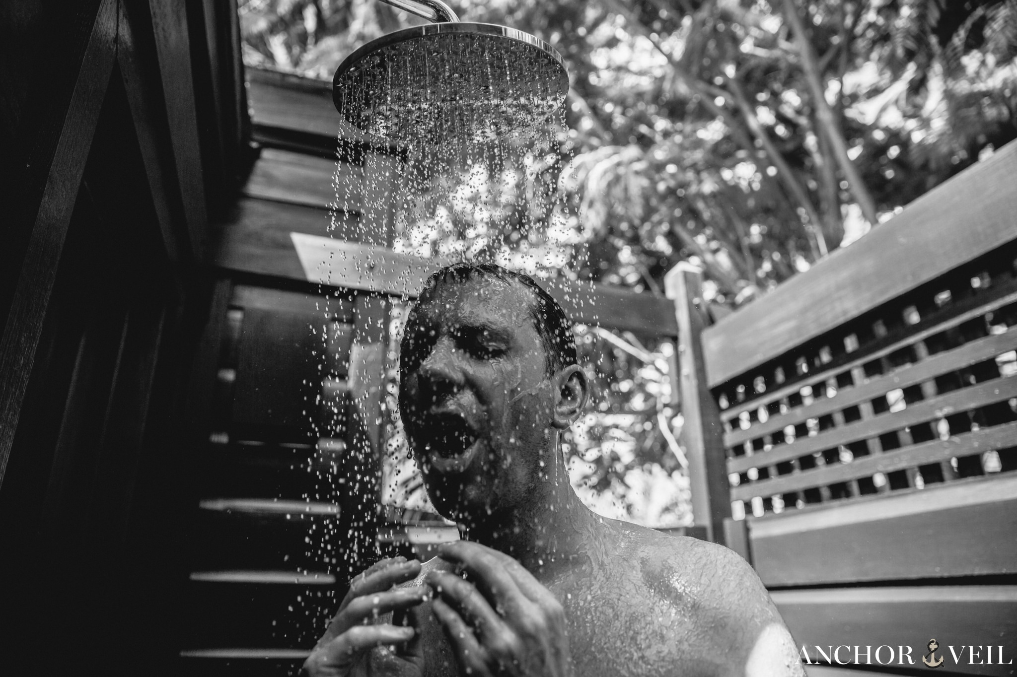 Groom showering with water
