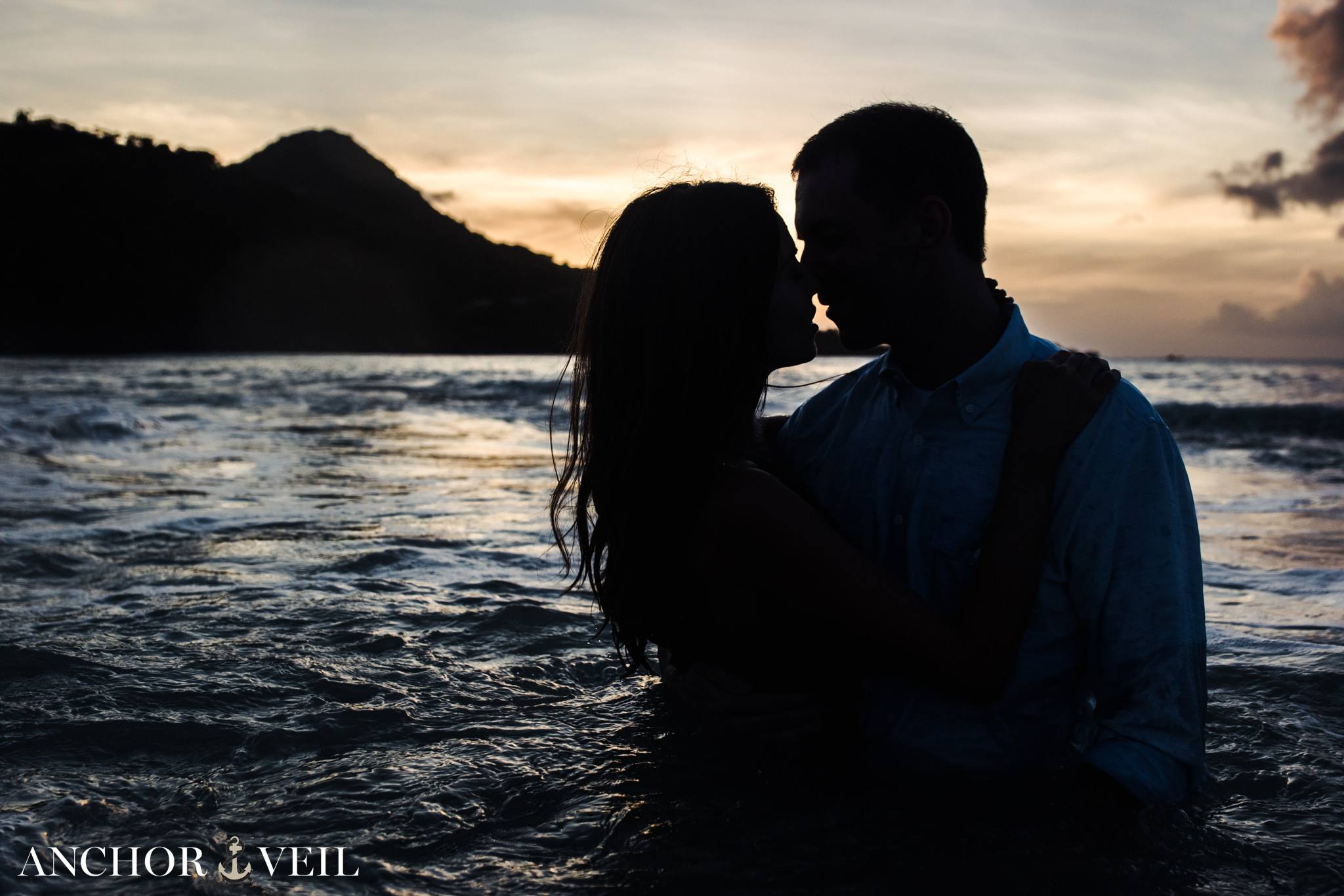 in the water with the sunset at Hermitage Bay wedding Shoot