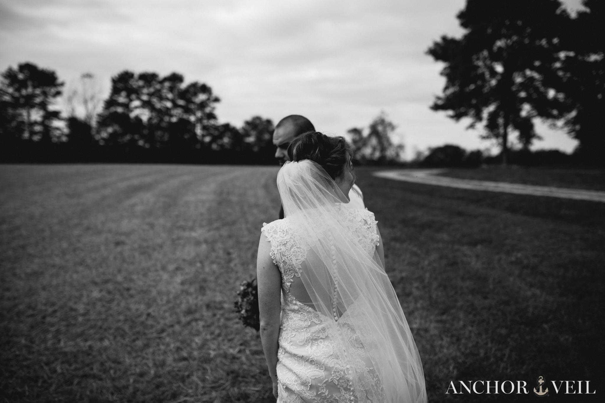 bride and groom walking together on the land at Hunting Creek Farms Wedding