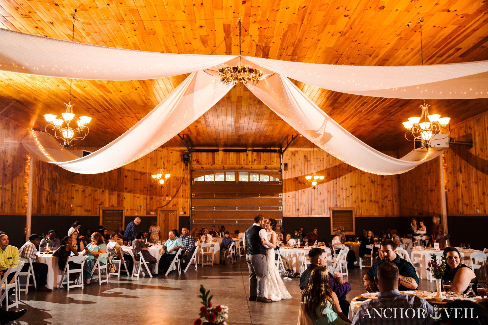first dance in the large barn in the Hunting Creek Farms Wedding