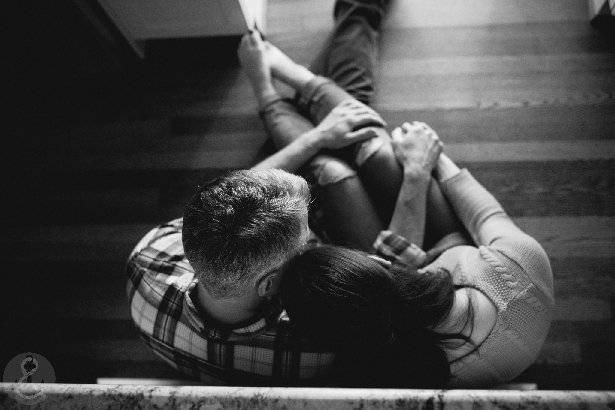 sitting next to each other during the in home kitchen engagement session