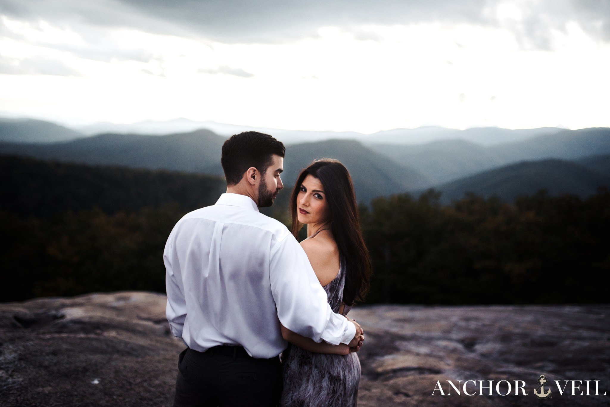 holding her facing the camera during the Stone Mountain Engagement Session