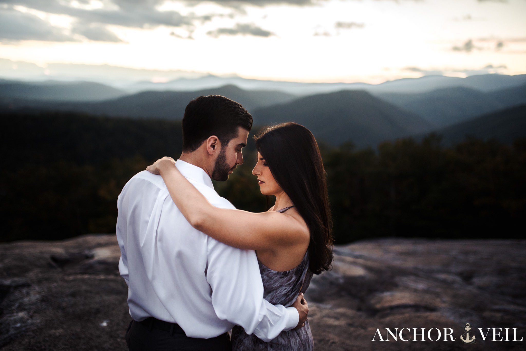 her arm around him during the Stone Mountain Engagement Session