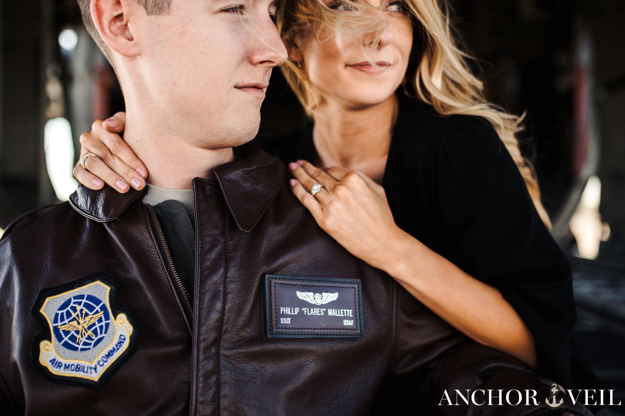 looking off into the distance during the aviation themed engagement session in Charlotte NC