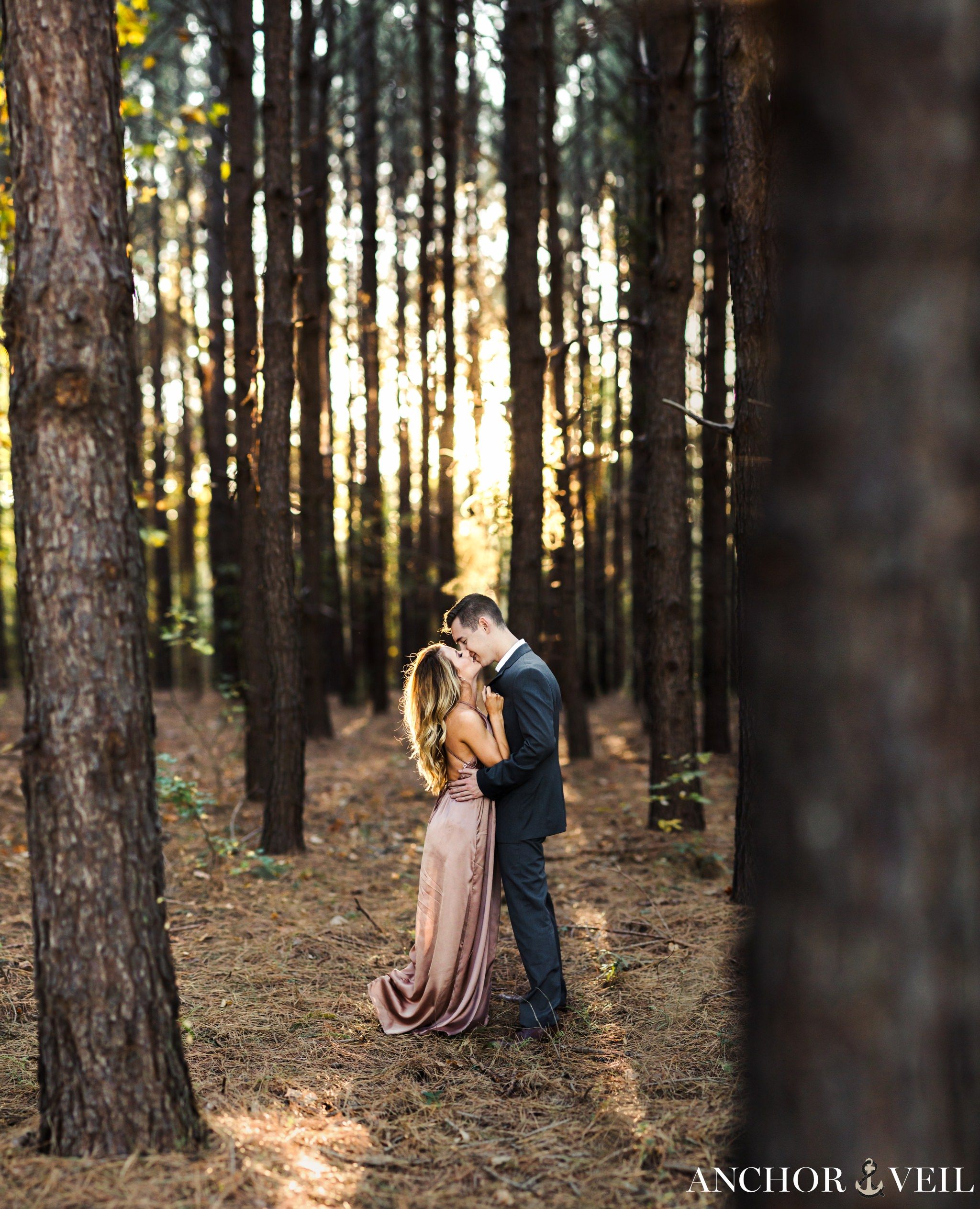 brenizer method in the tree forest during their charlotte engagement session