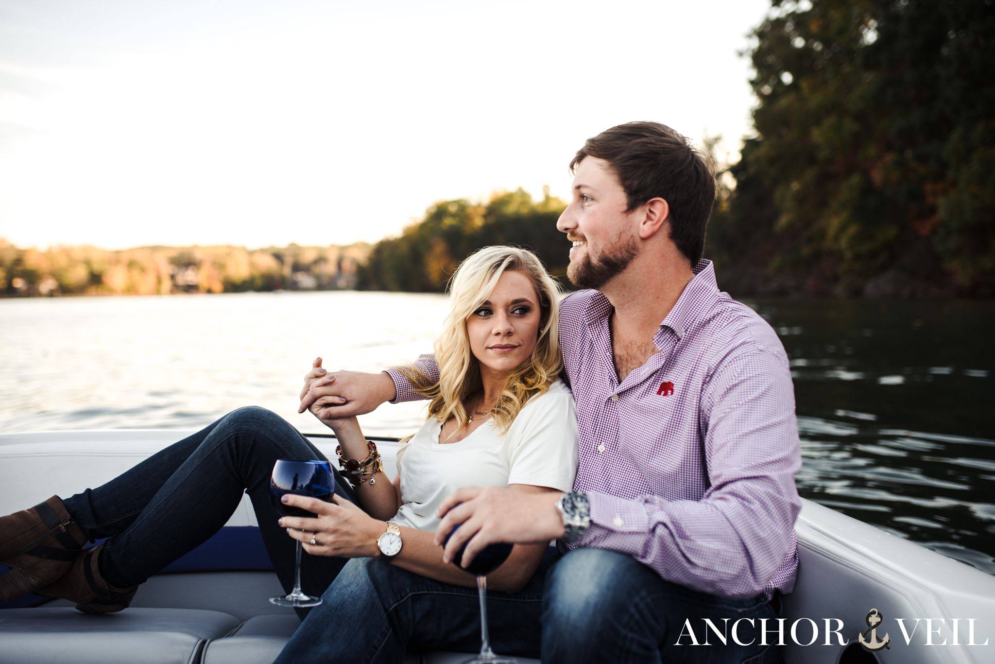 leaning back on him in the boat during the belews lake engagement session