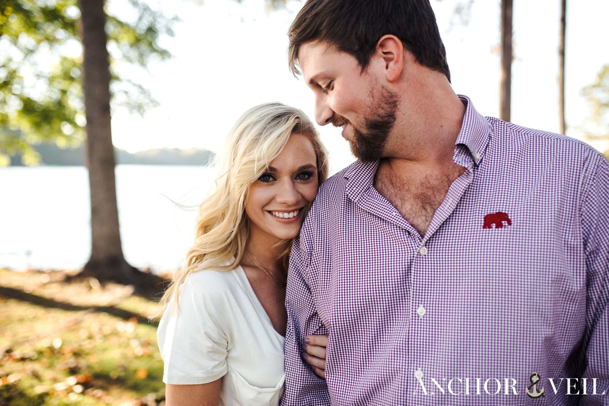 holding onto his arm during the belews lake engagement session