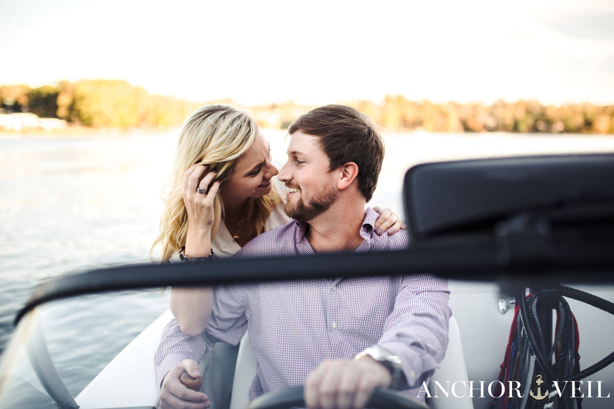 looking at him while he drives during the belews lake engagement session