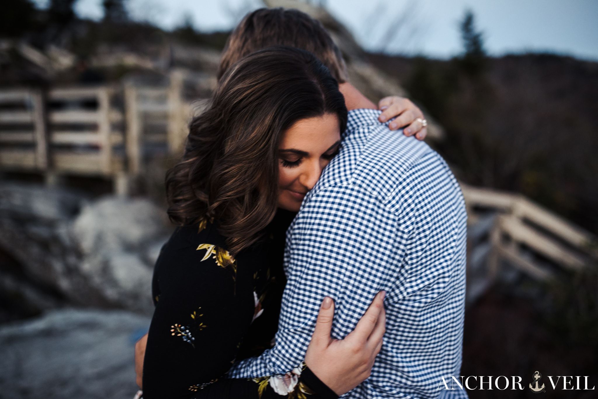 holding each other on rough ridge during the this engagement Session