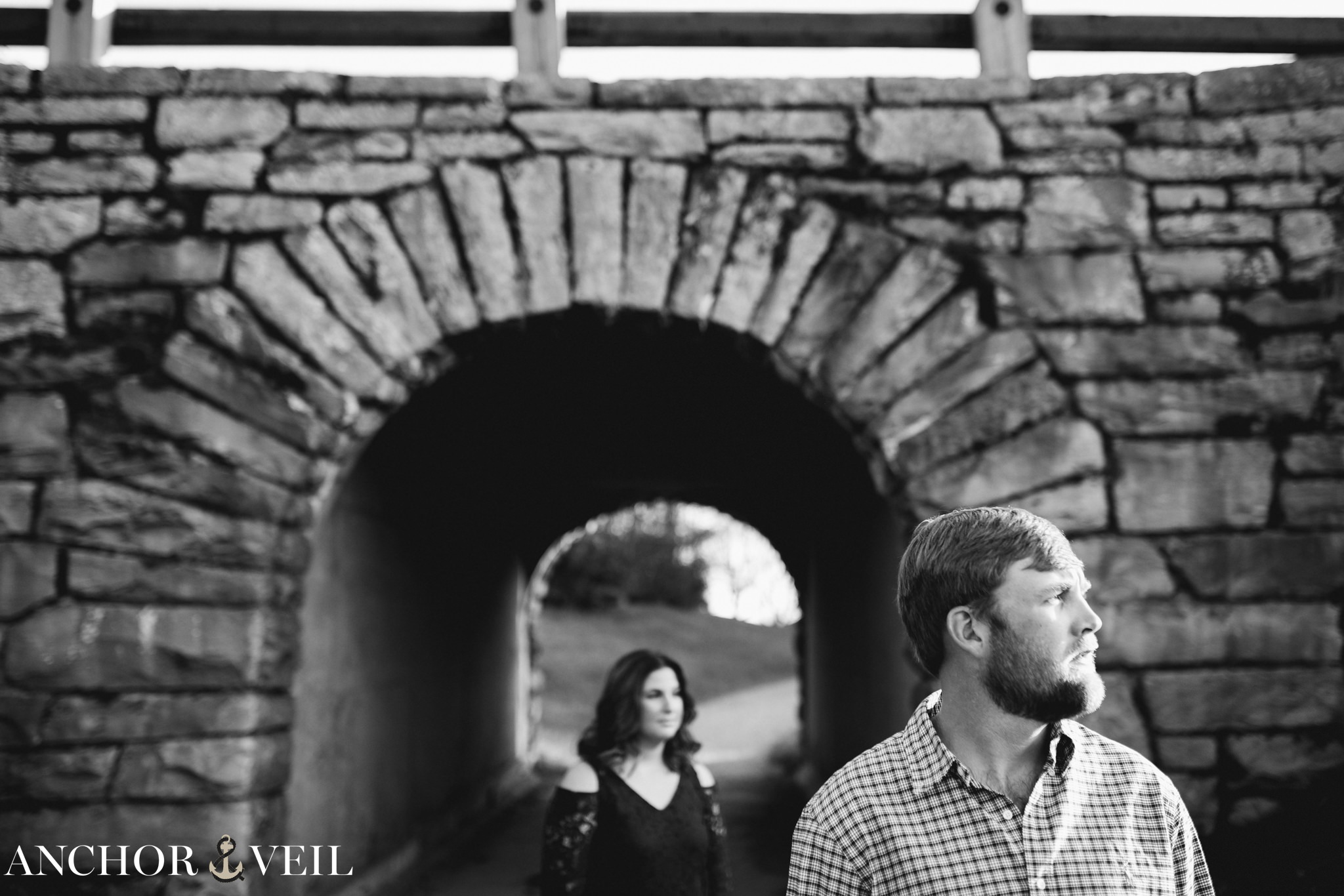 using the tunnel as they look away during the Blue Ridge Mountains Engagement Session
