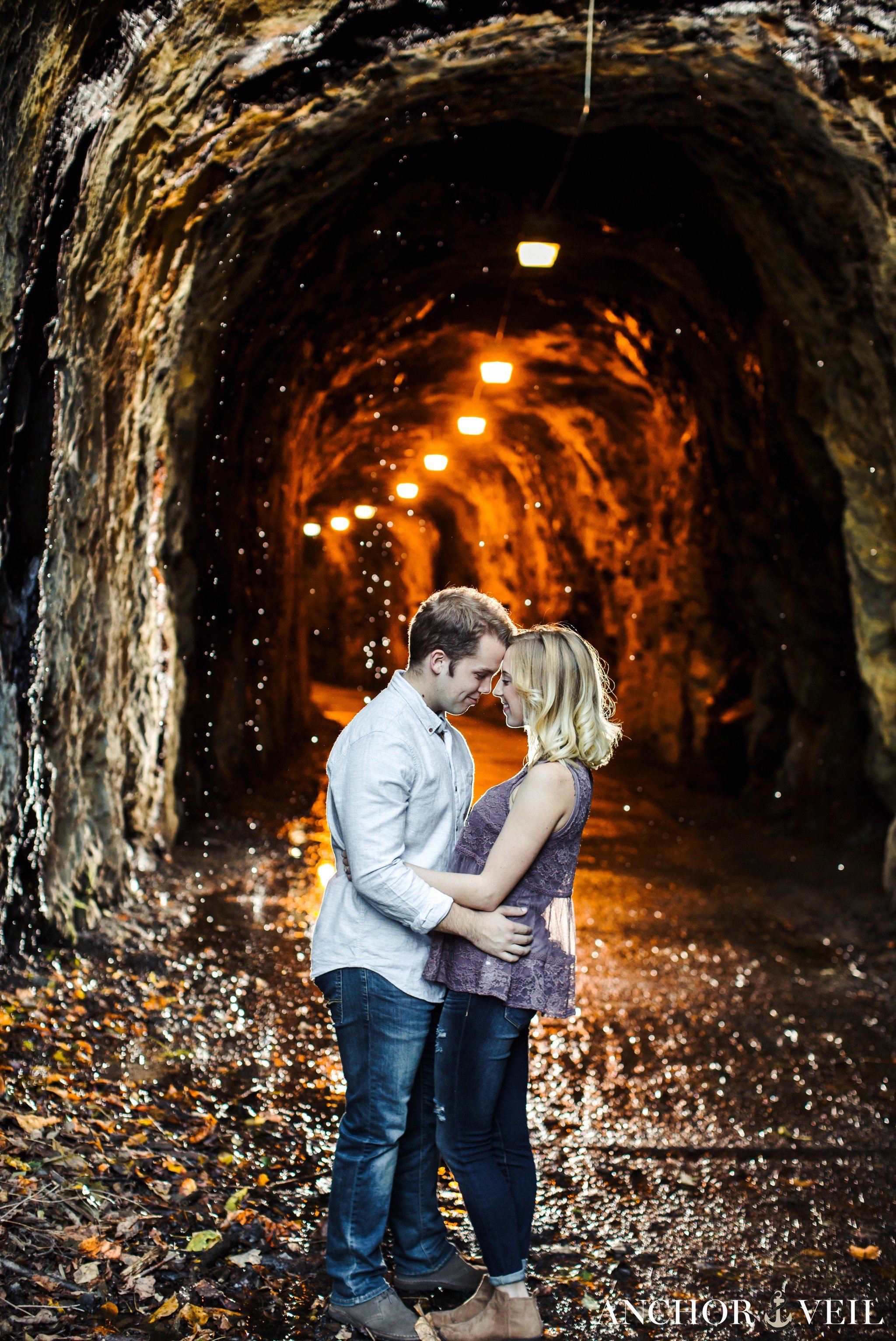 water dripping from the tunnel with backlight during the Hollins Mill Park Engagement Session