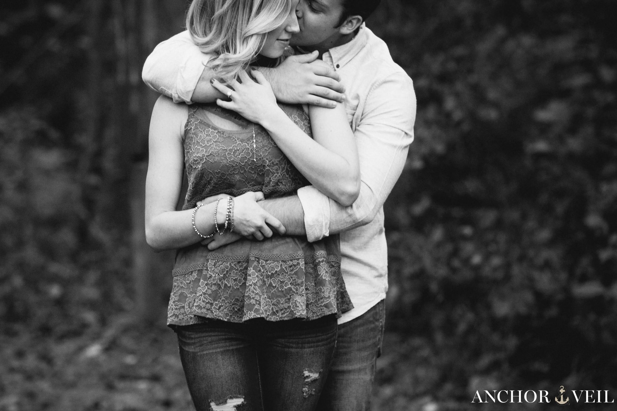 cropped down black and white holding her tight during the Hollins Mill Park Engagement Session