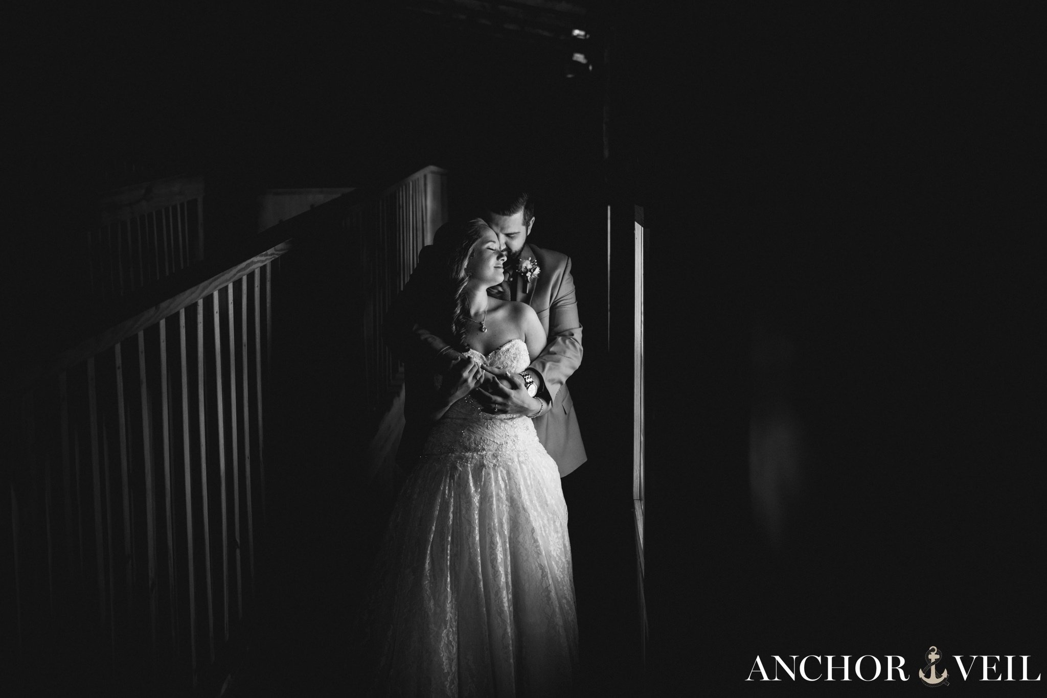 bride and groom hugging next to the light