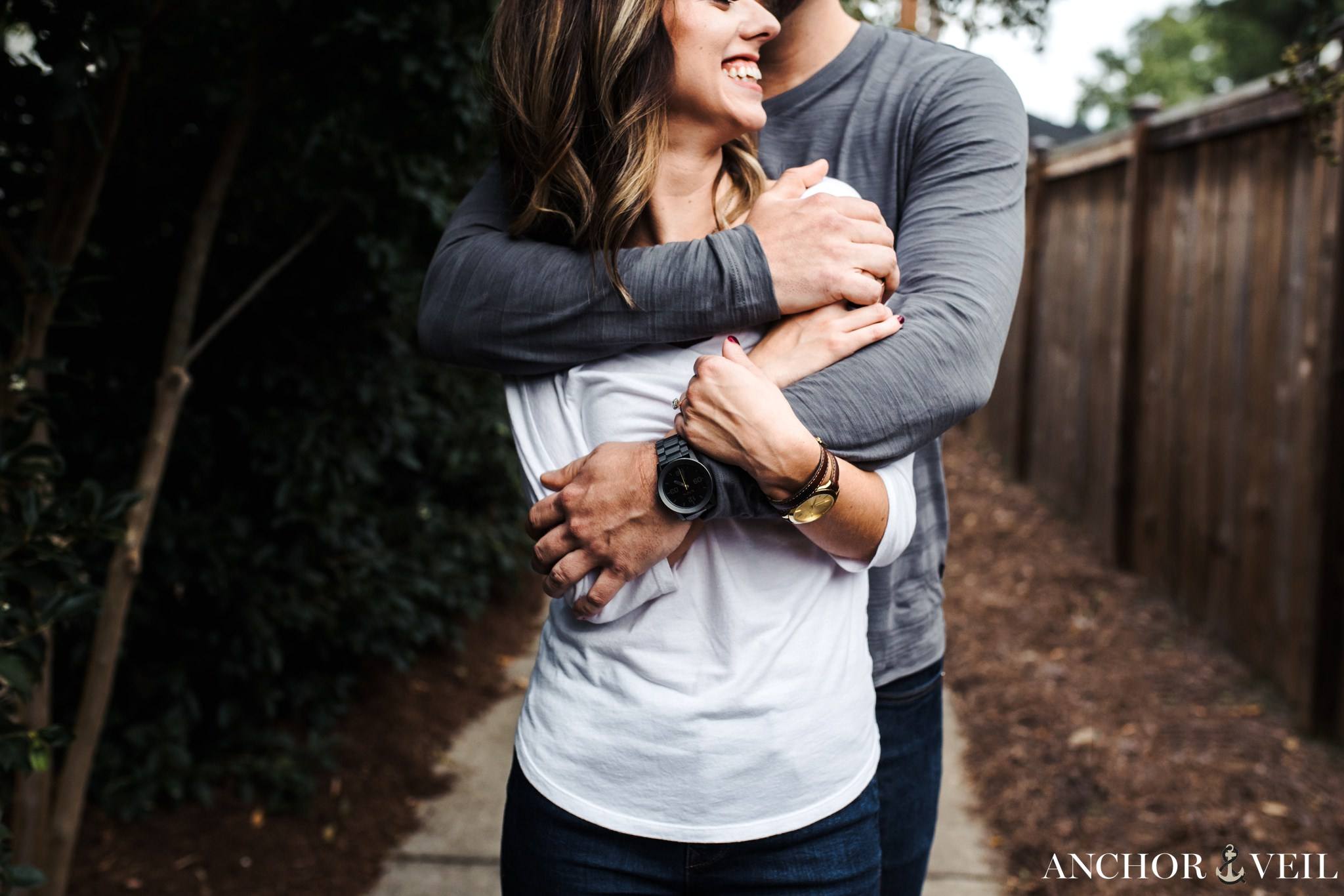 holding and squeezing tight during the Uptown Charlotte Engagement Session