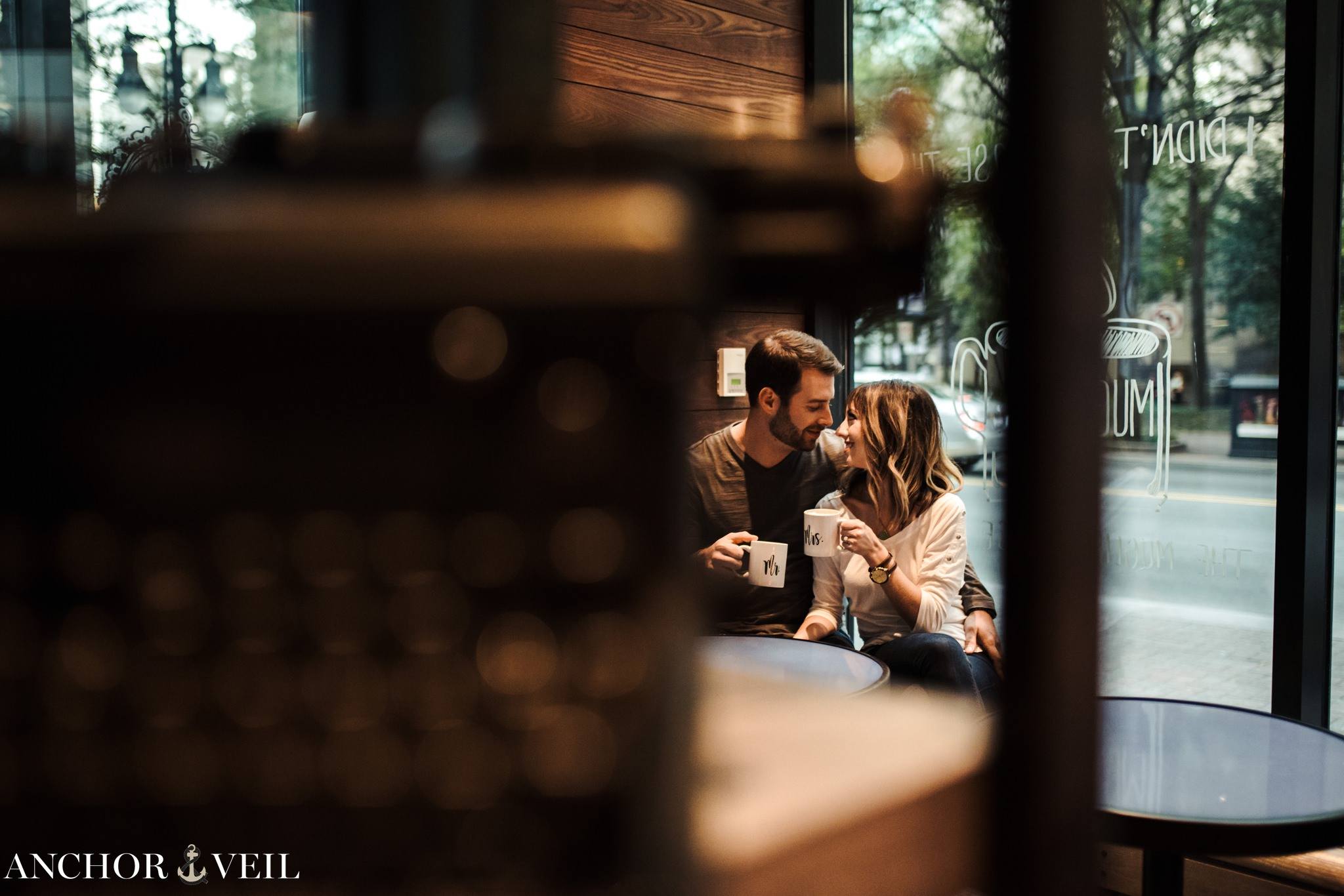 inside of the Coco and the Director Coffee Shop during the Uptown Charlotte Engagement Session