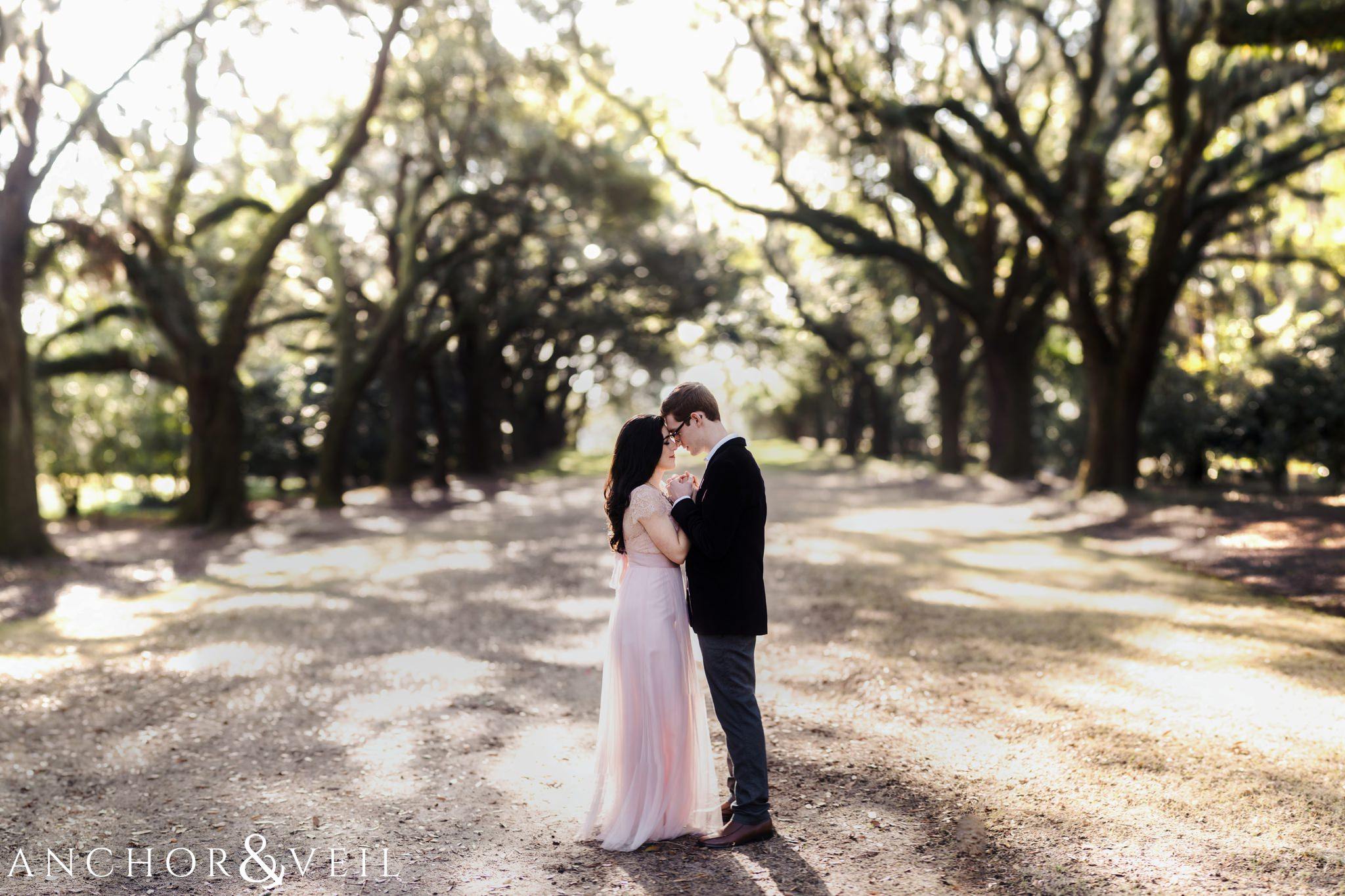 brenizer method in the trees during their legare waring house engagement session