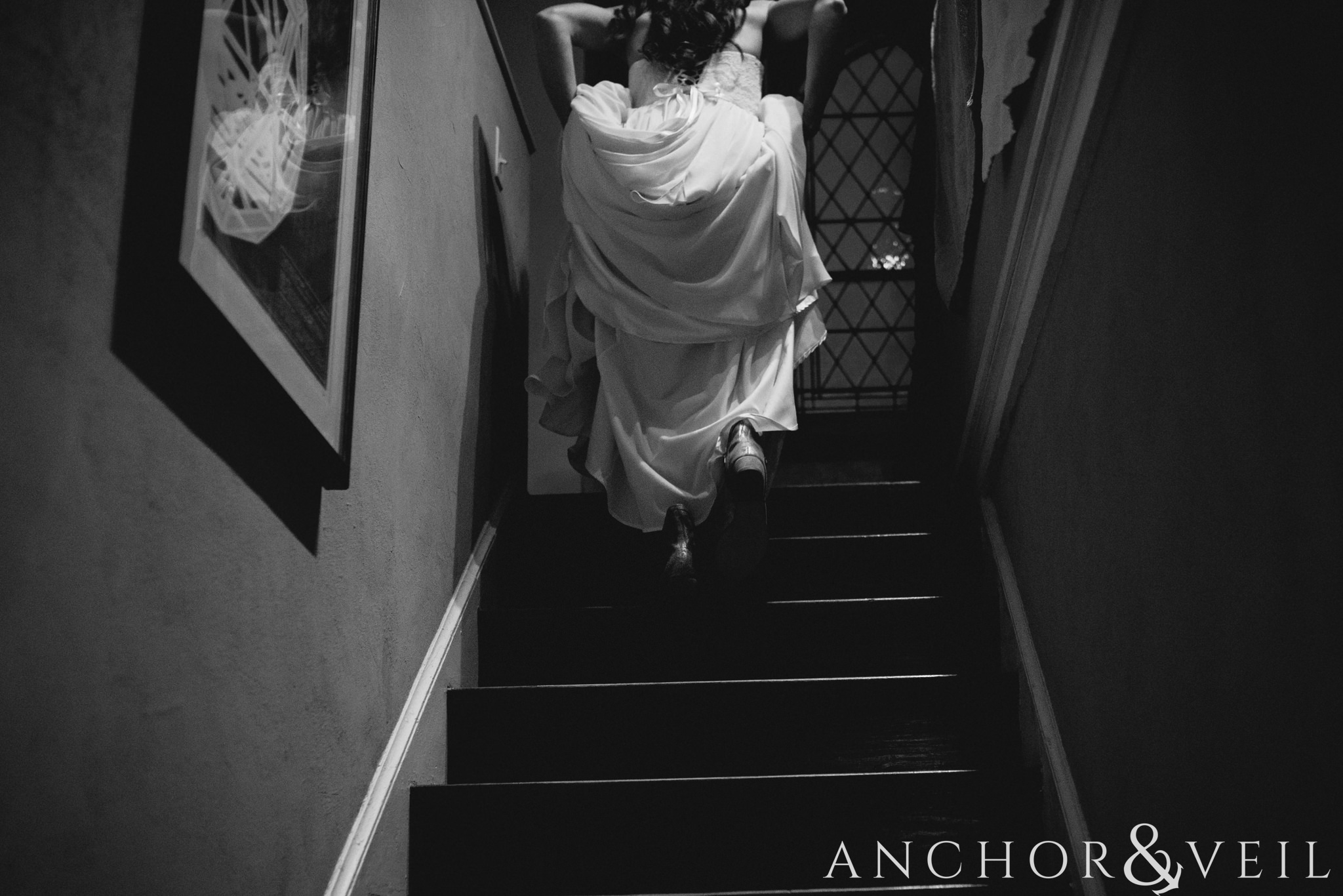 walking up the stairs During their University Laundry wedding in Dallas texas
