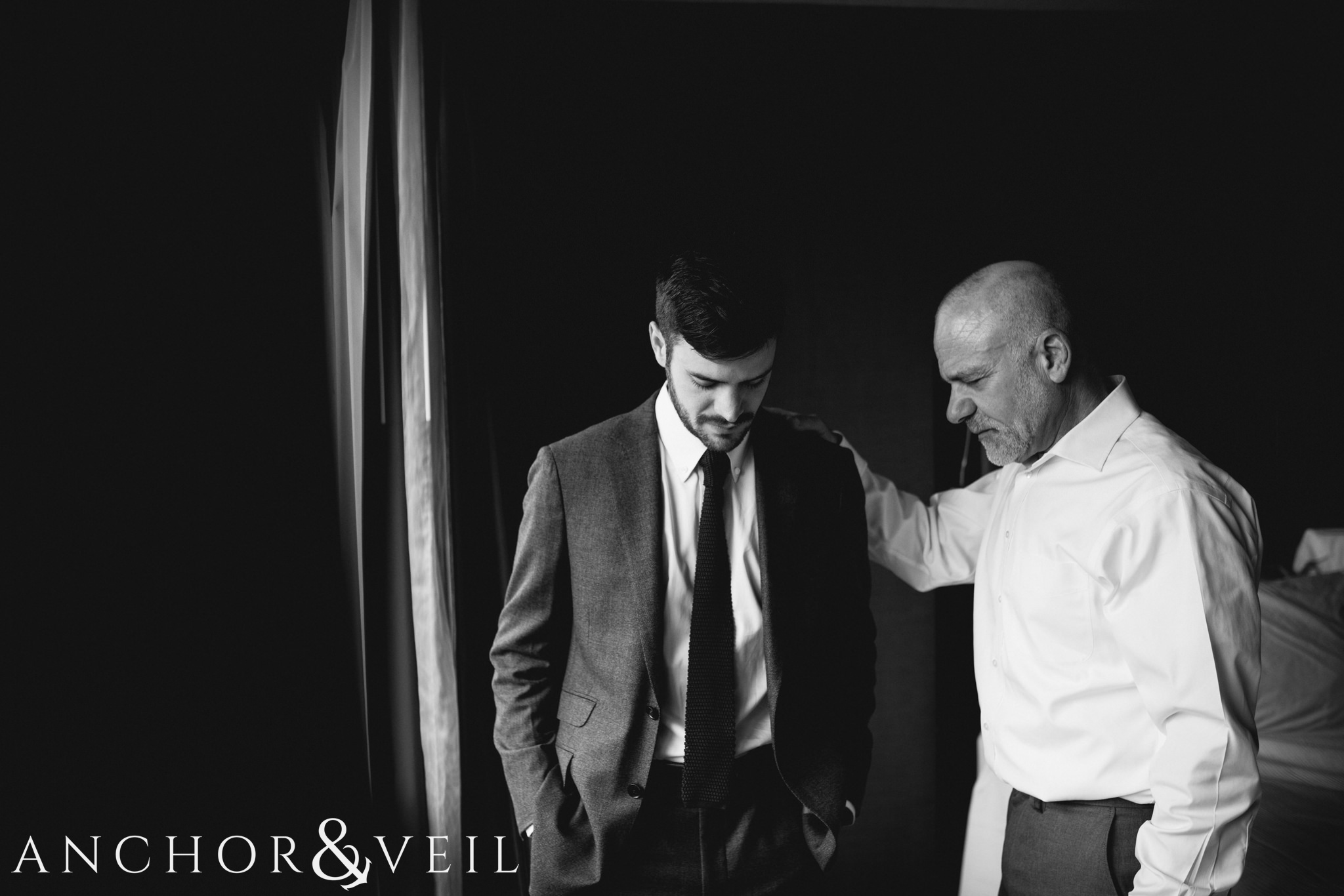 father and son prayer During their University Laundry wedding in Dallas texas