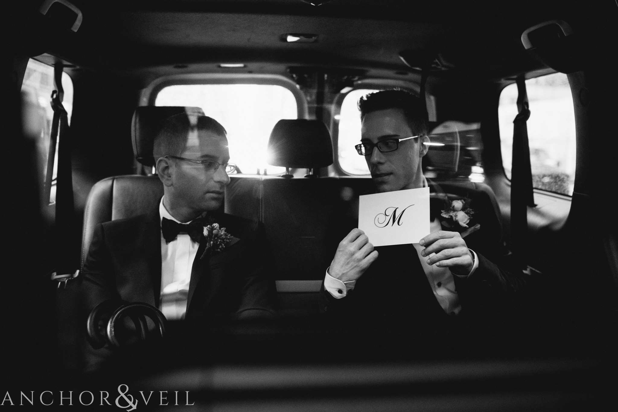 Getting ready in the cab during their central park elopement in bethesda Terrace