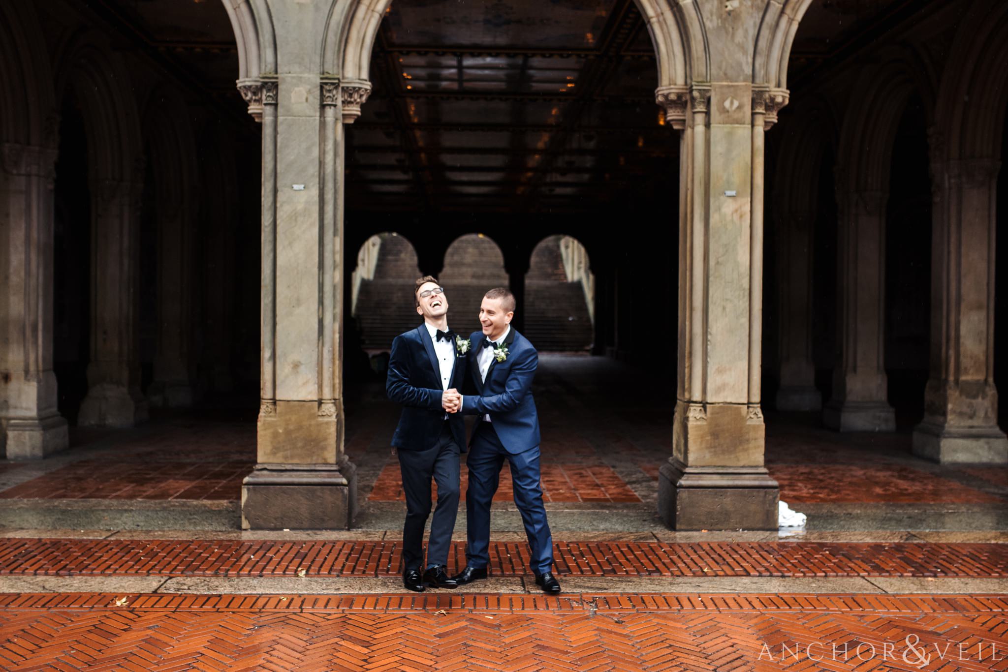 dancing in front of the arches during their central park elopement in bethesda Terrace