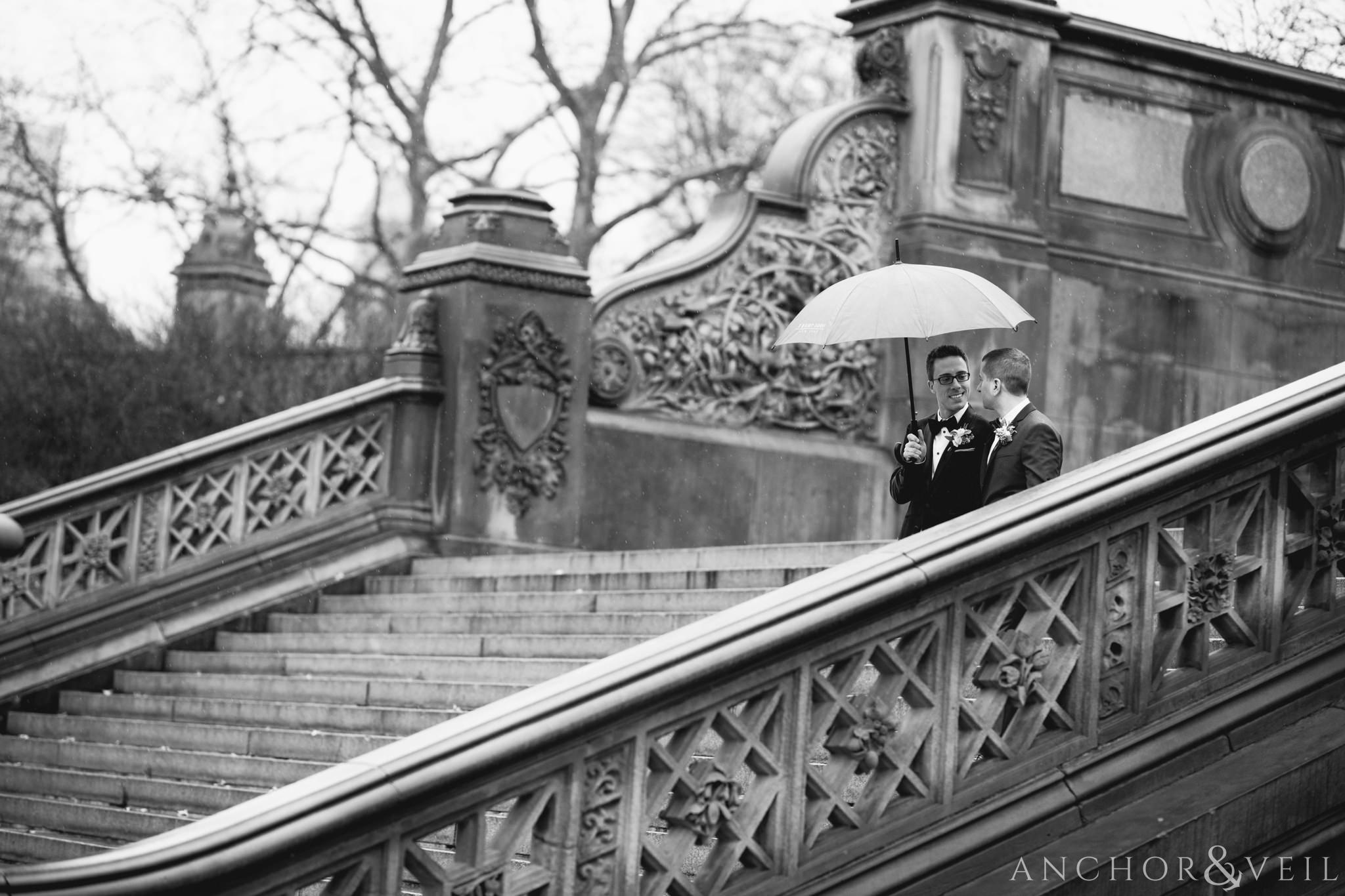 walking down the stairs during their central park elopement in bethesda Terrace