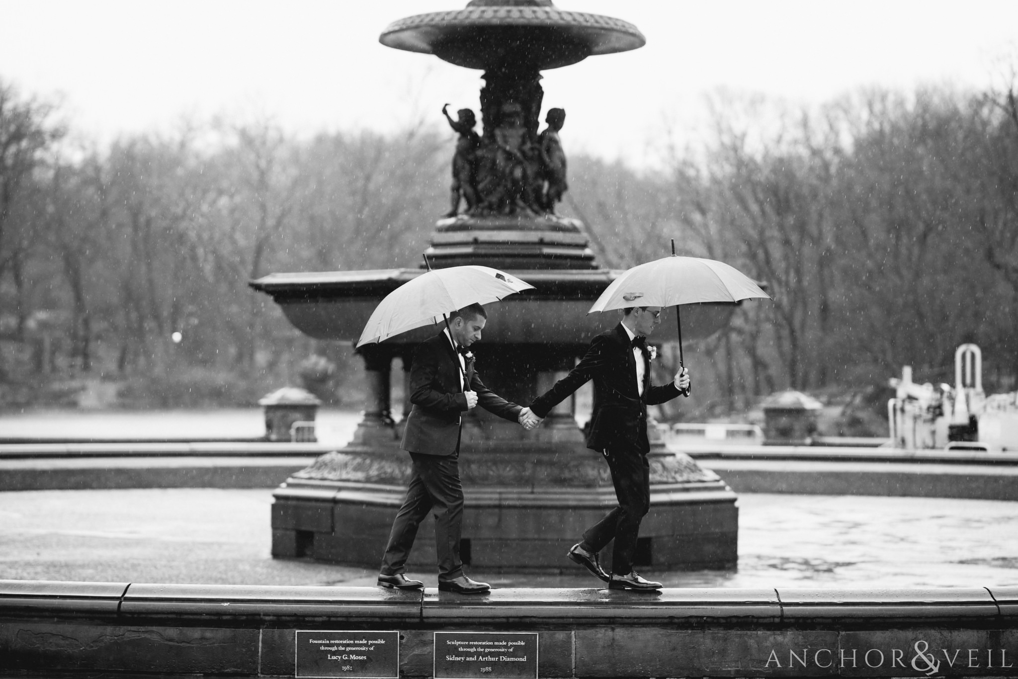 walking on the fountain during their central park elopement in bethesda Terrace