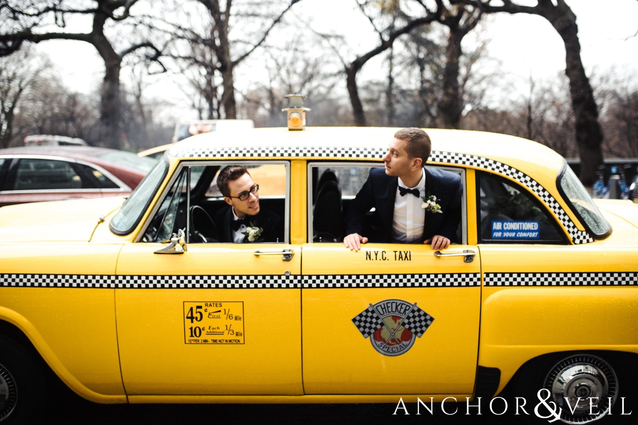 sticking their head out of the cab during their central park elopement in bethesda Terrace