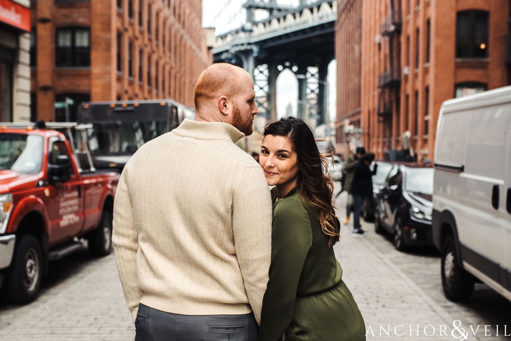 post against brooklyn bridge backdrop During their Dumbo Brooklyn New York engagement session