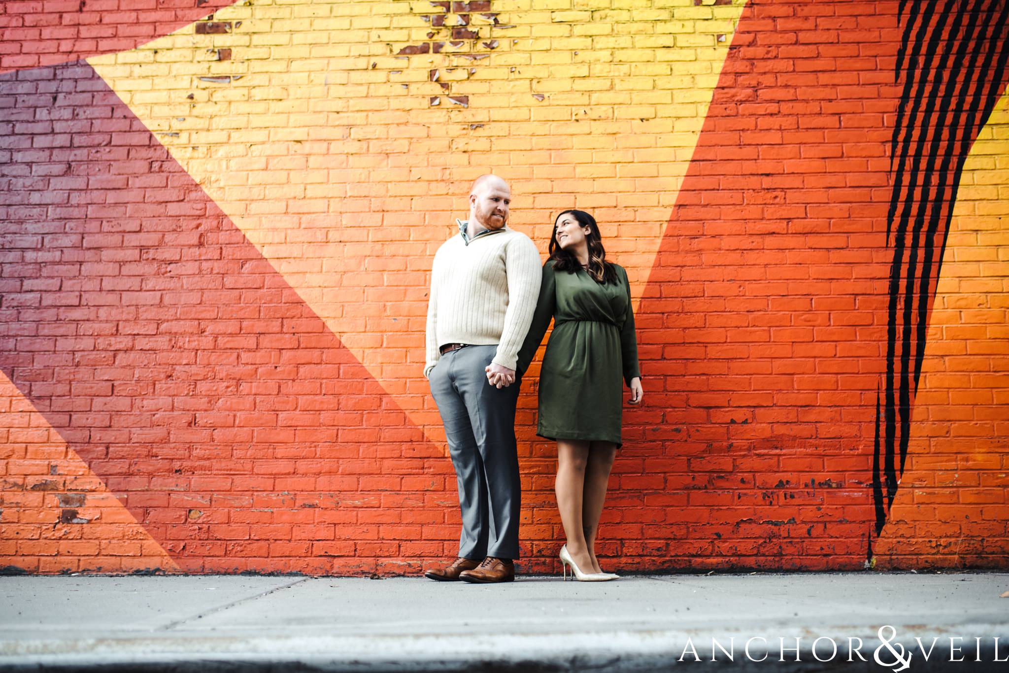 triangles and the colors mural During their Dumbo Brooklyn New York engagement session