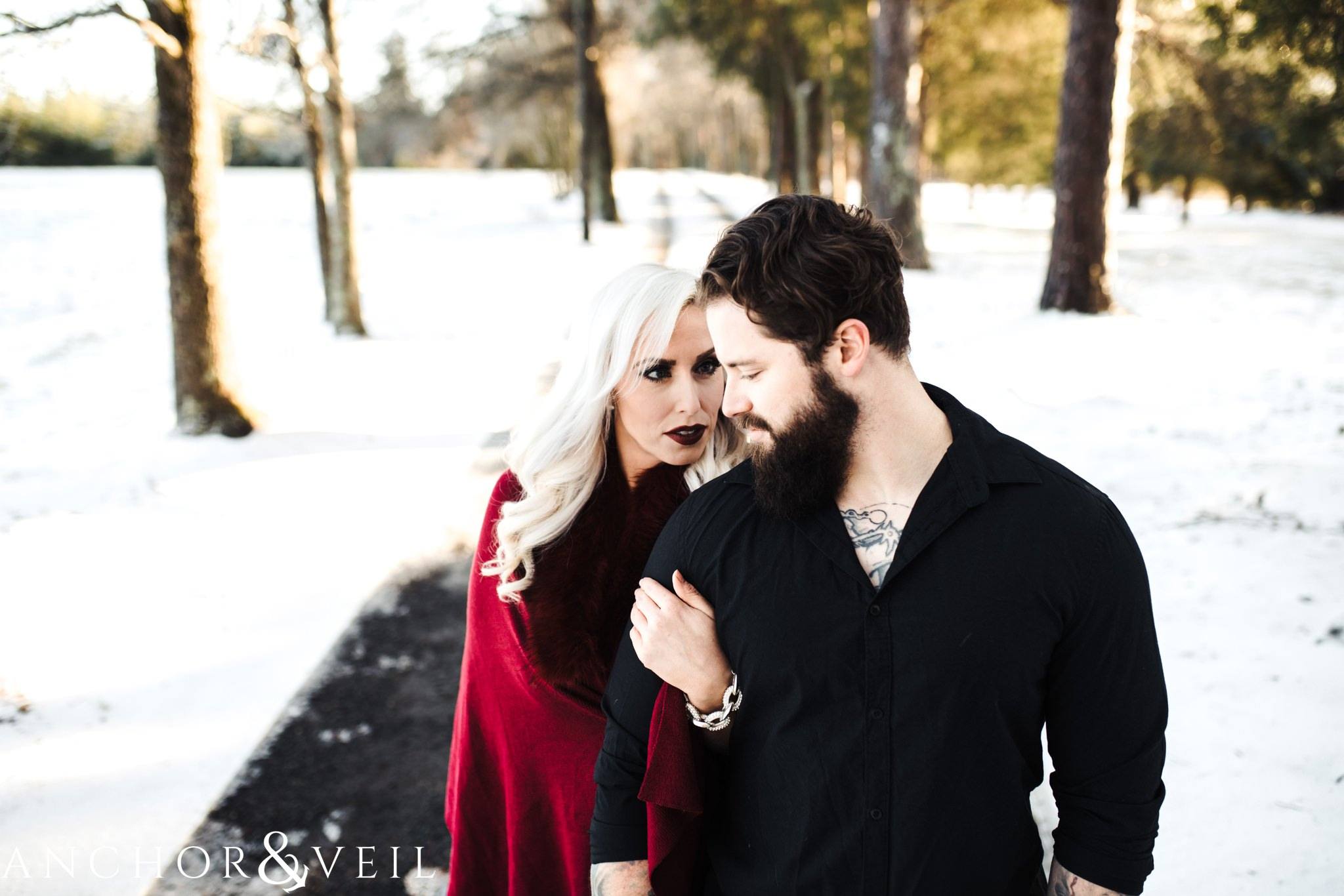 coming in close on the road during their charlotte snow engagement session