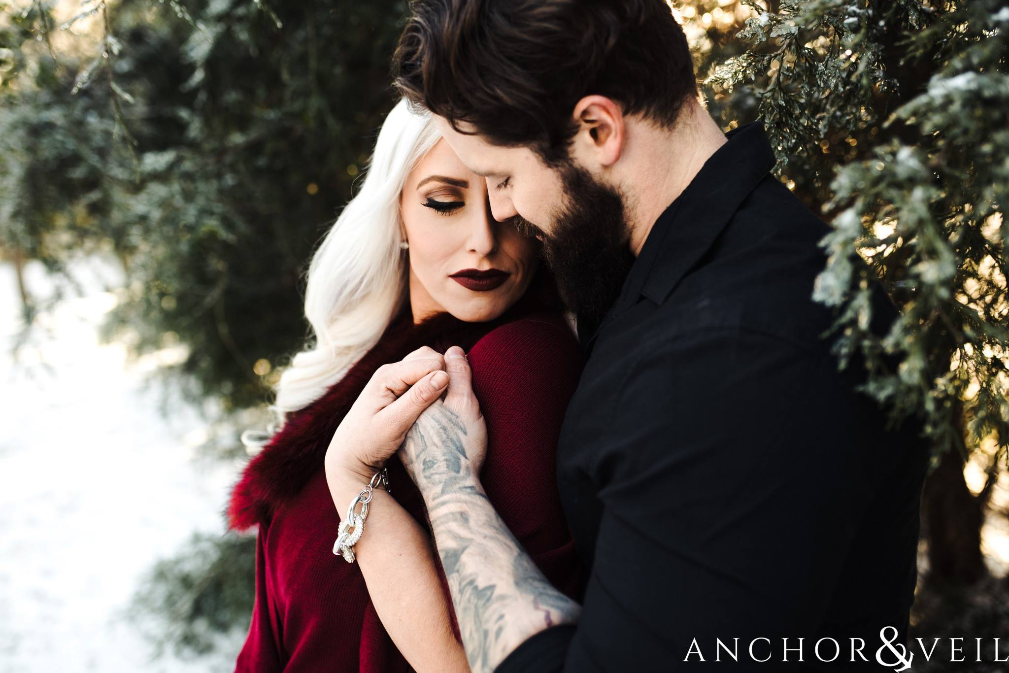 coming in close, puzzle pieces with faces during their charlotte snow engagement session