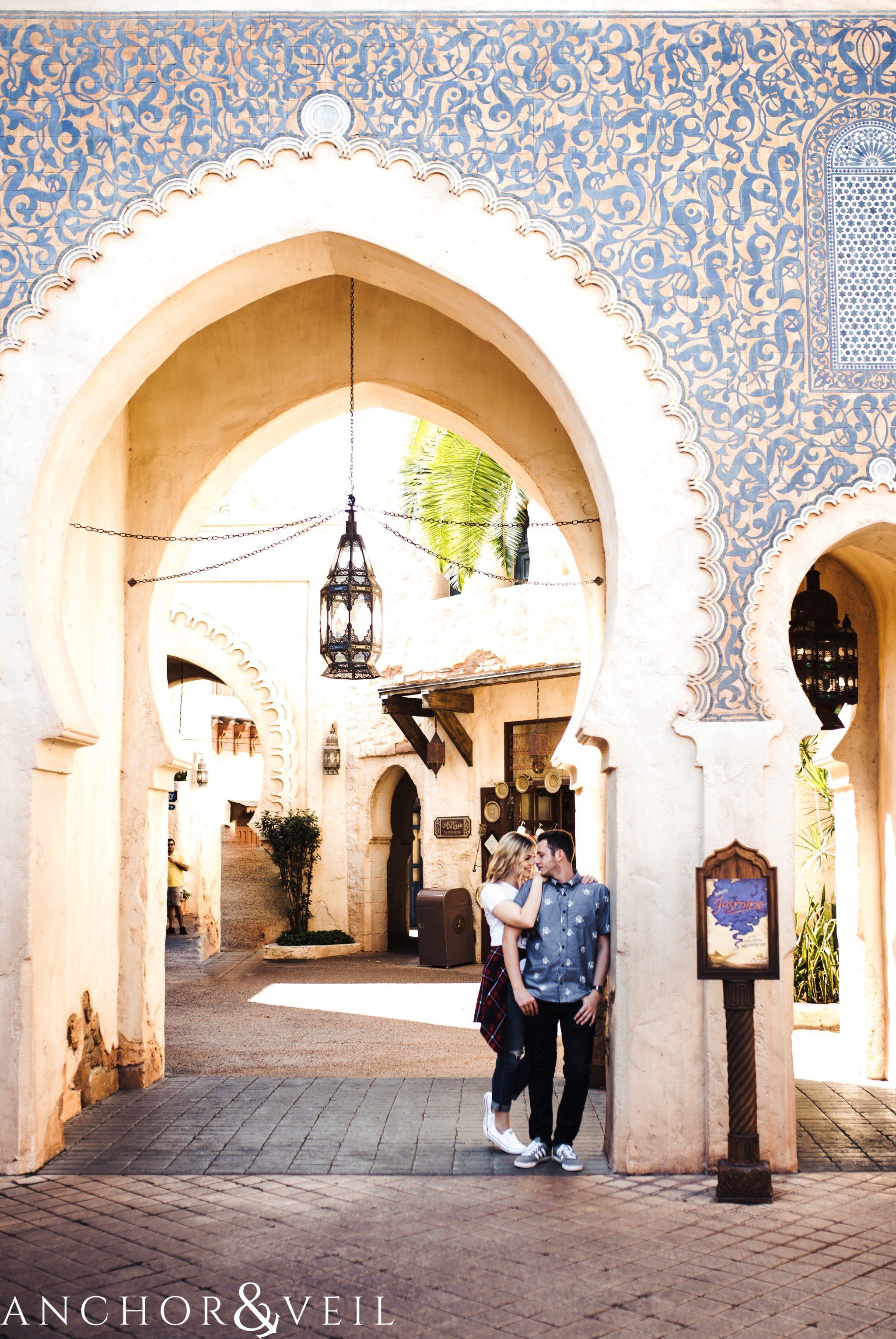 arches in morocco during their Disney world engagement session at Disney's Epcot