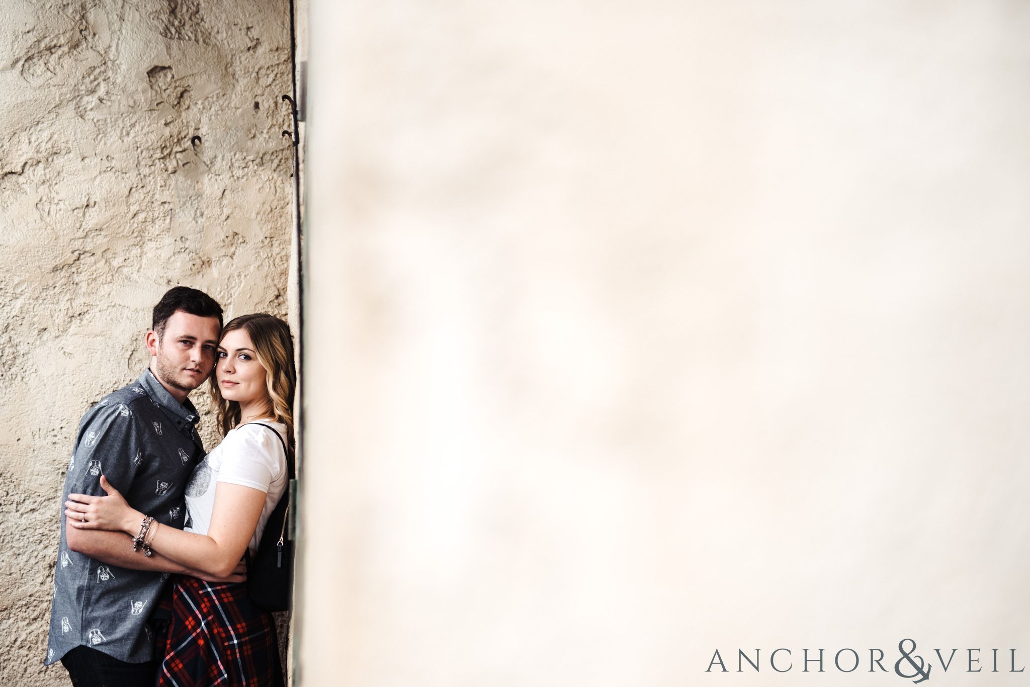 in the corner in morocco during their Disney world engagement session at Disney's Epcot