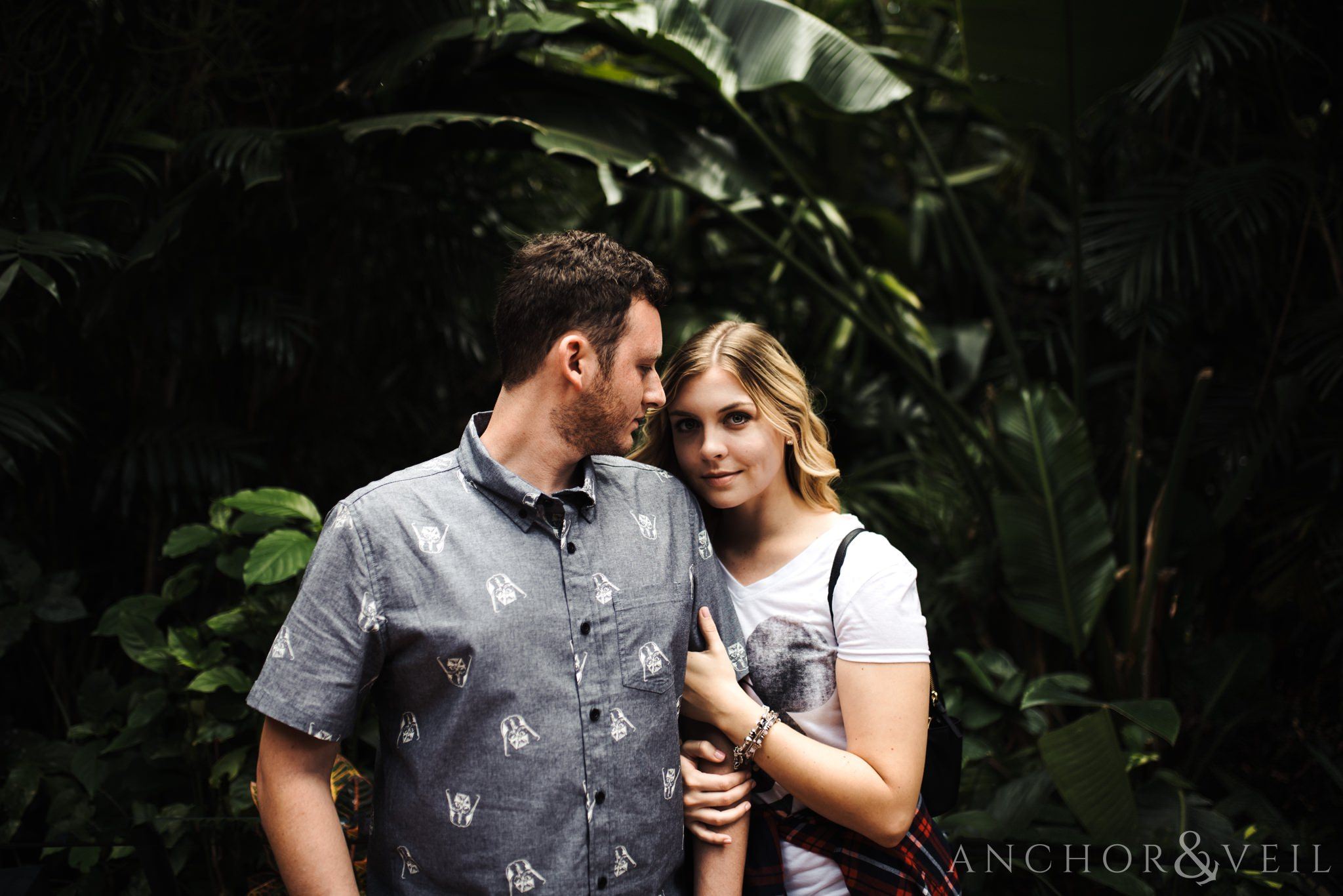 in the jungle of mexico during their Disney world engagement session at Disney's Epcot