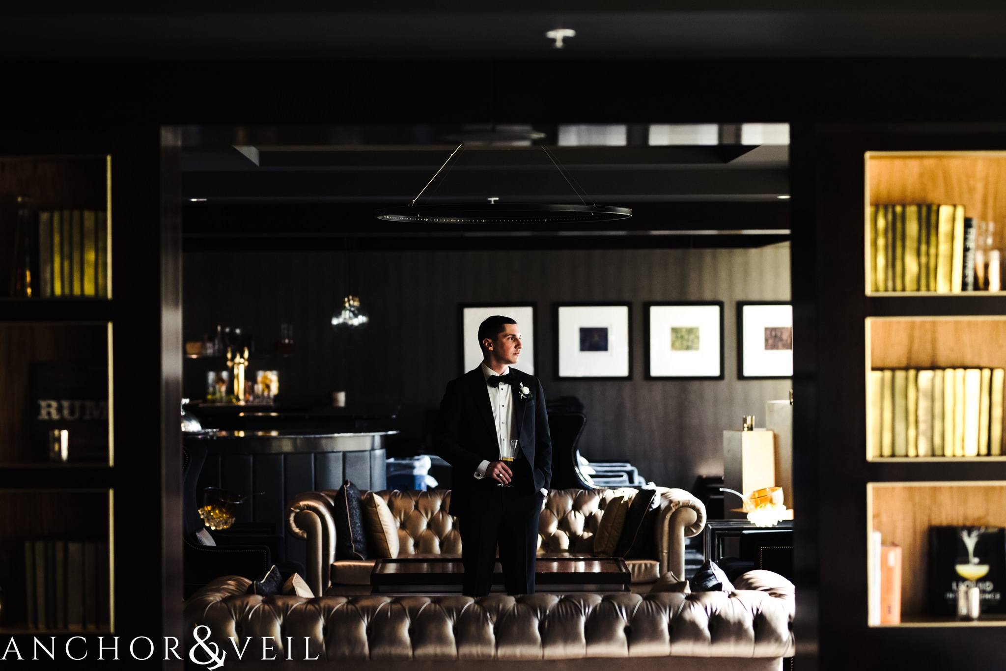groom in the punch room during their ritz Carlton wedding in Uptown Charlotte NC