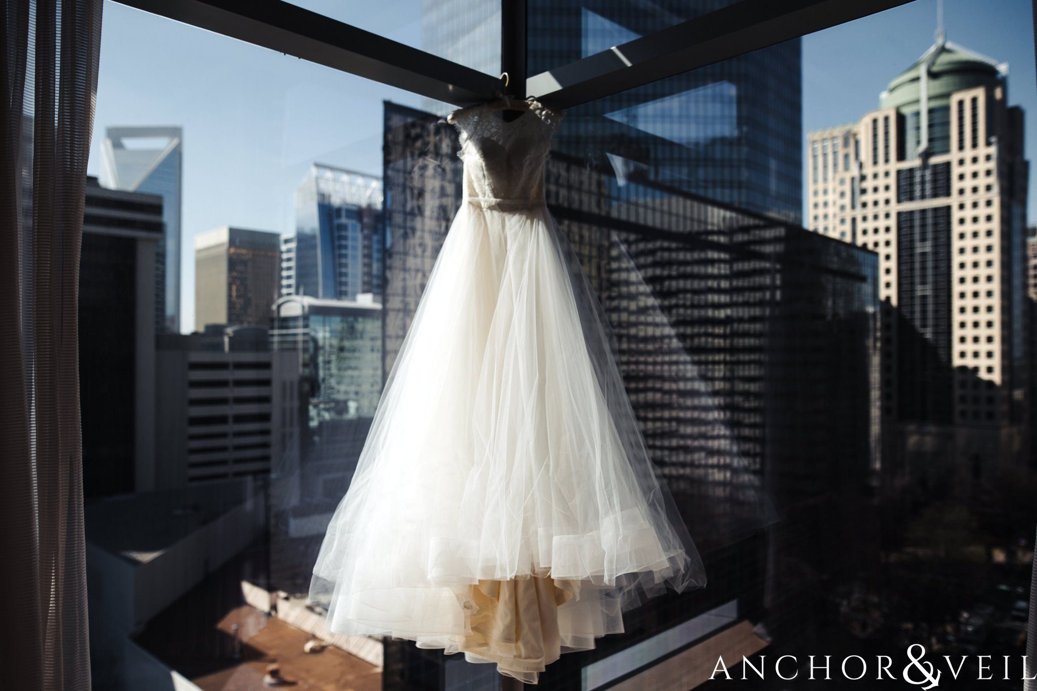 Haley Paige Dress hanging during their ritz Carlton wedding in Uptown Charlotte NC