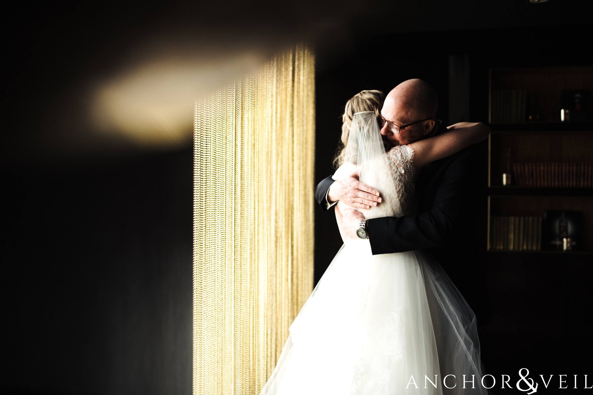 father daughter first look in the punch room during their ritz Carlton wedding in Uptown Charlotte NC