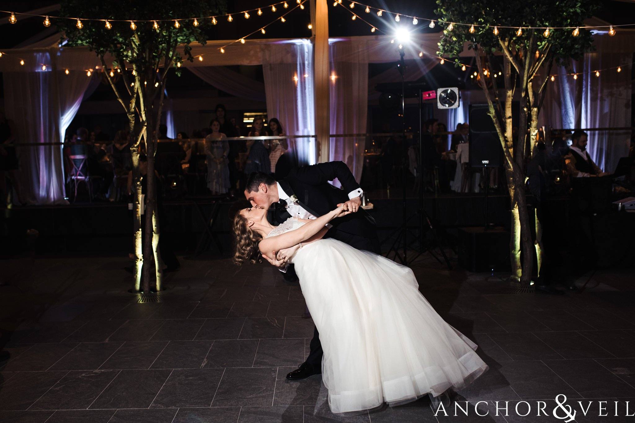 doing a dip during the reception during their ritz Carlton wedding in Uptown Charlotte NC