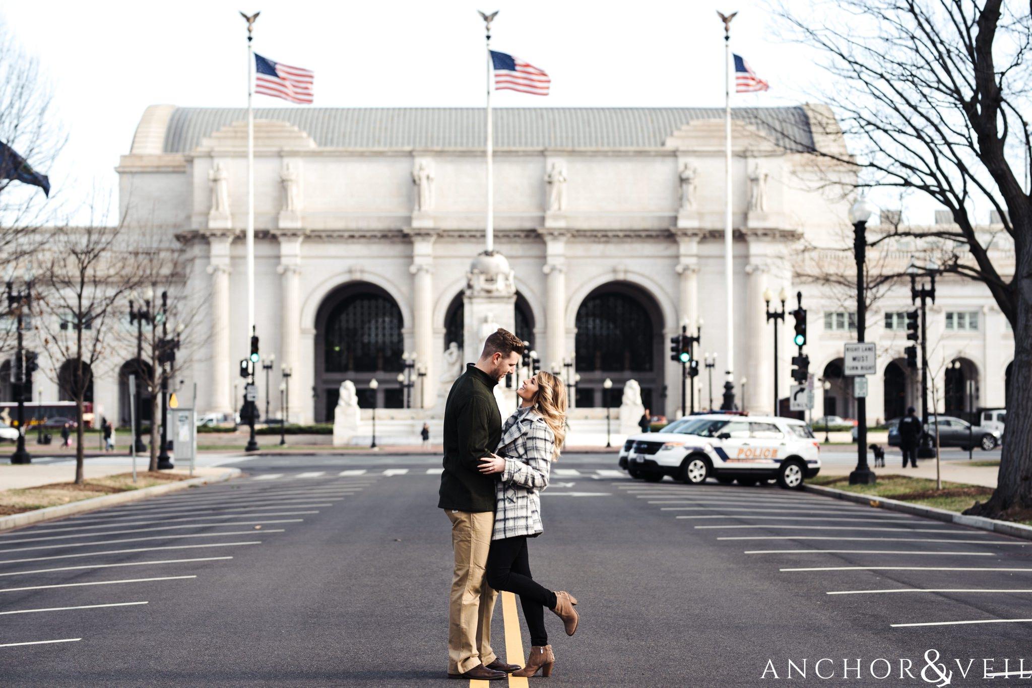 in front of union station during their Scenic Washington DC Engagement Session