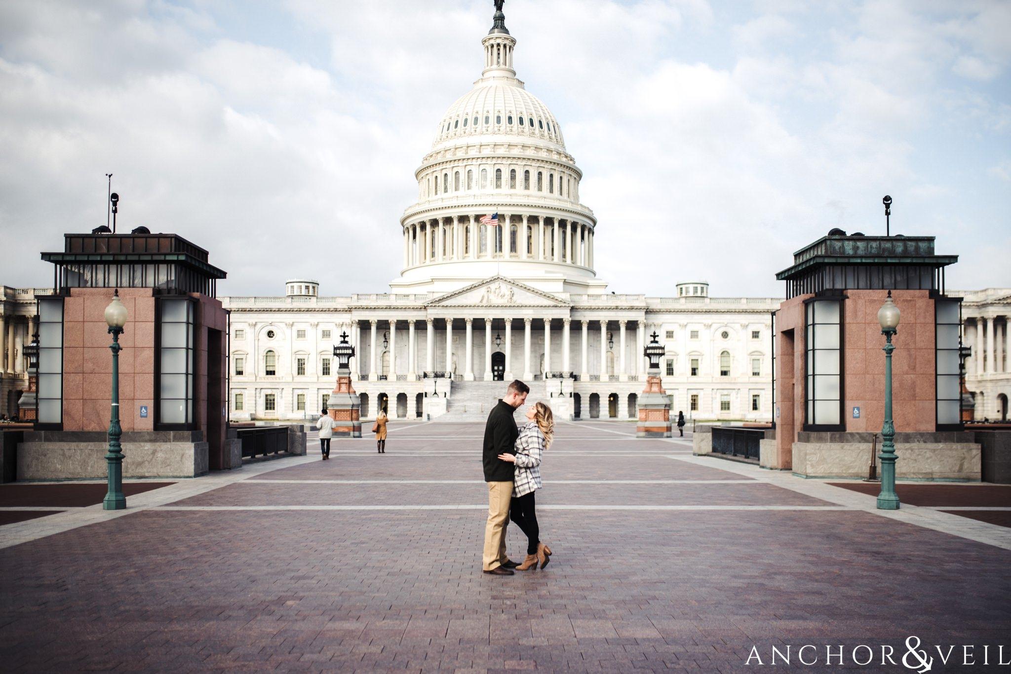 the capitol building during their Scenic Washington DC Engagement Session