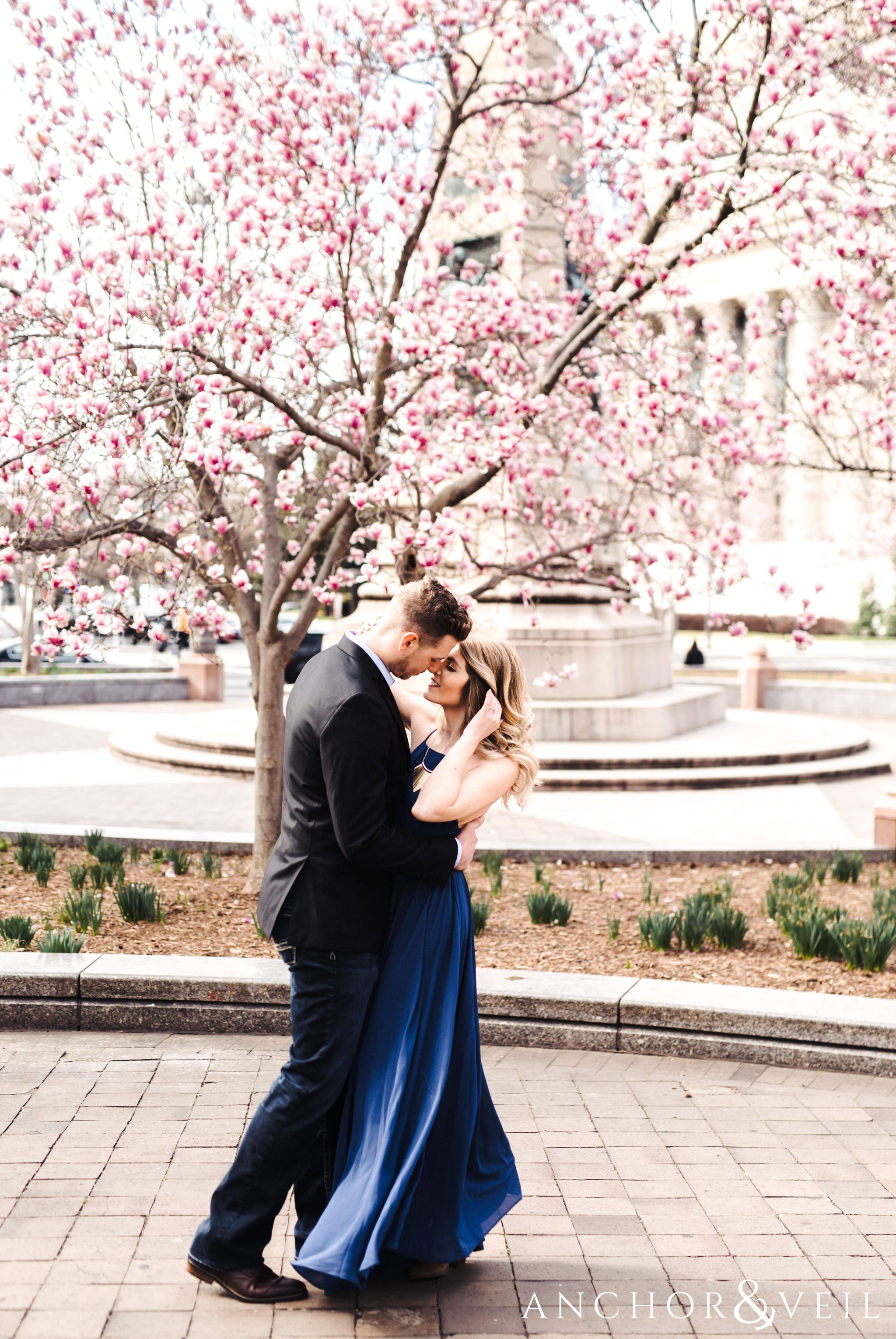 cherry blossoms during their Scenic Washington DC Engagement Session