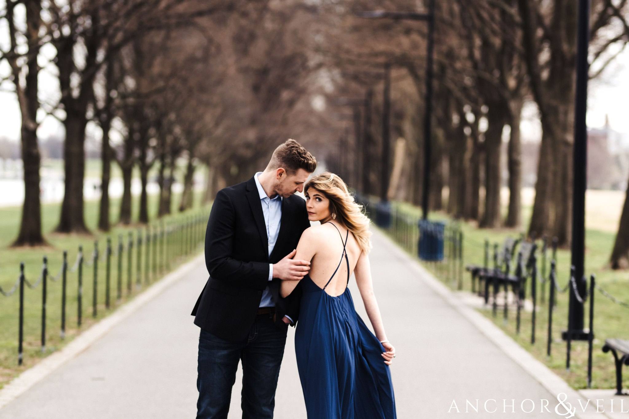 on the walkway of trees during their Scenic Washington DC Engagement Session