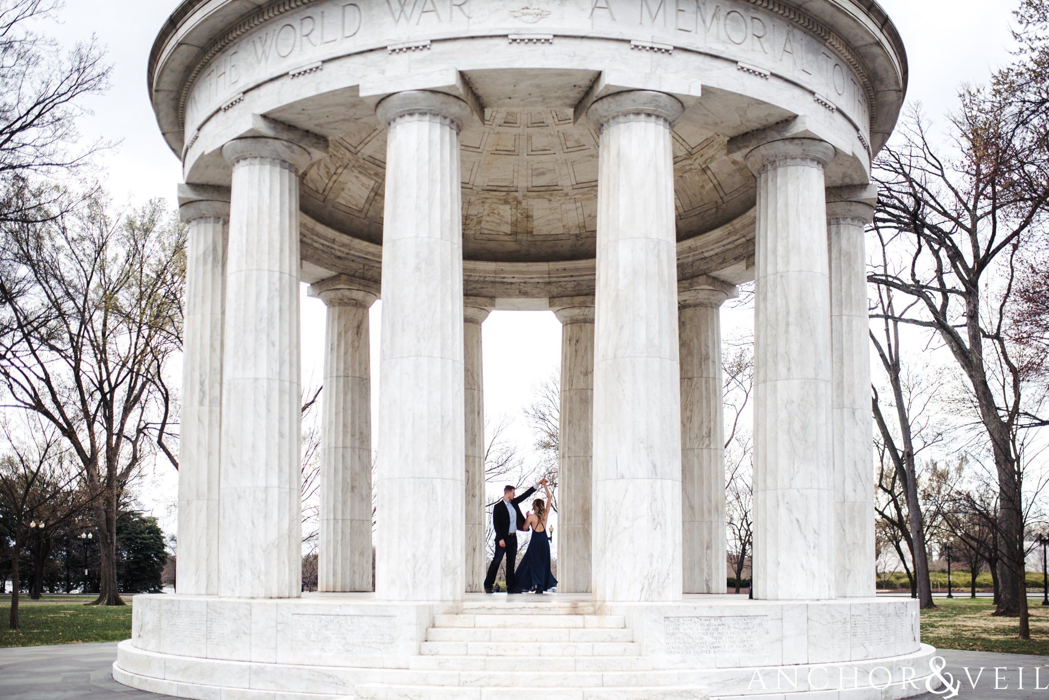 spinning her at the war memorial during their Scenic Washington DC Engagement Session