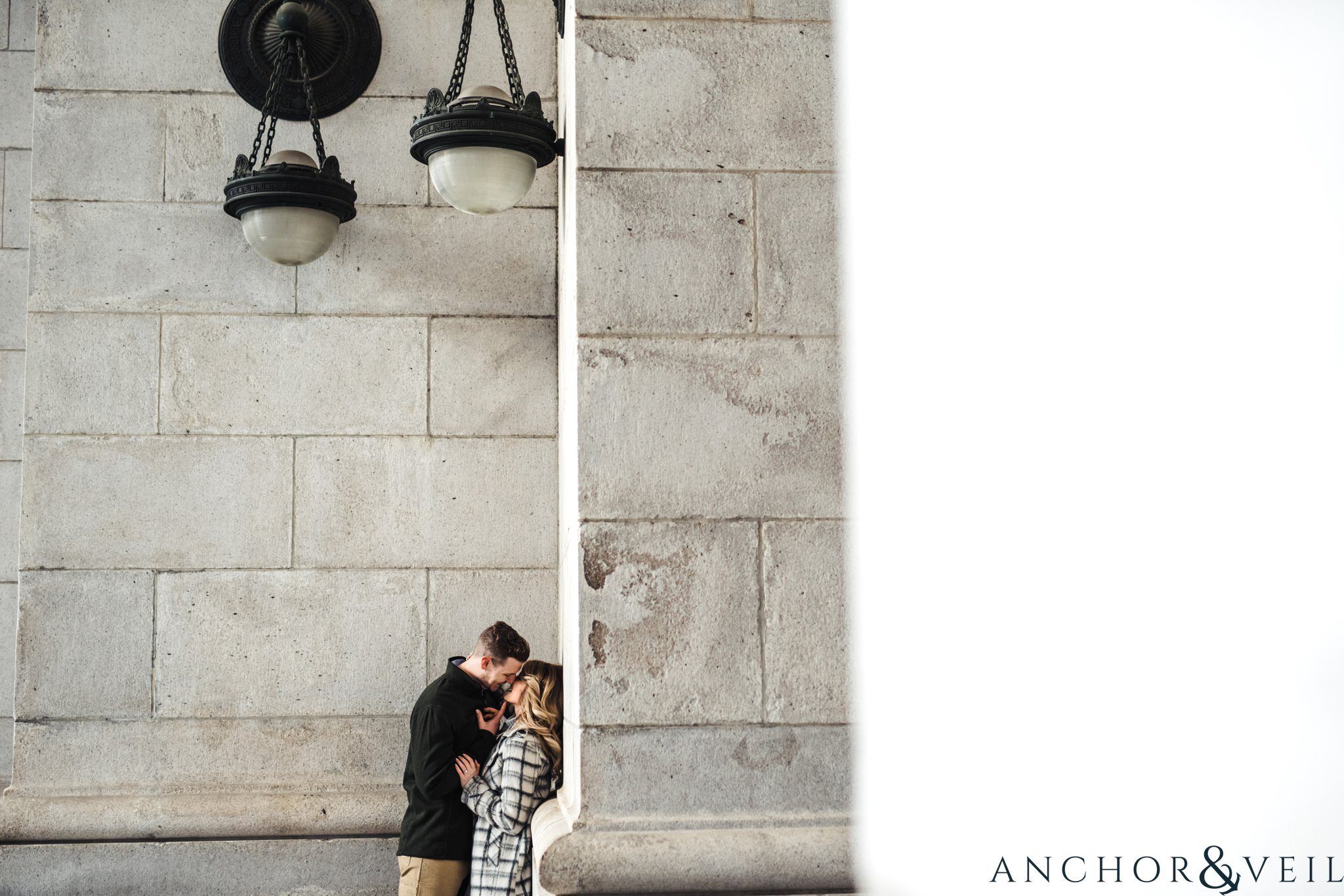 under the lamps at union station during their Scenic Washington DC Engagement Session