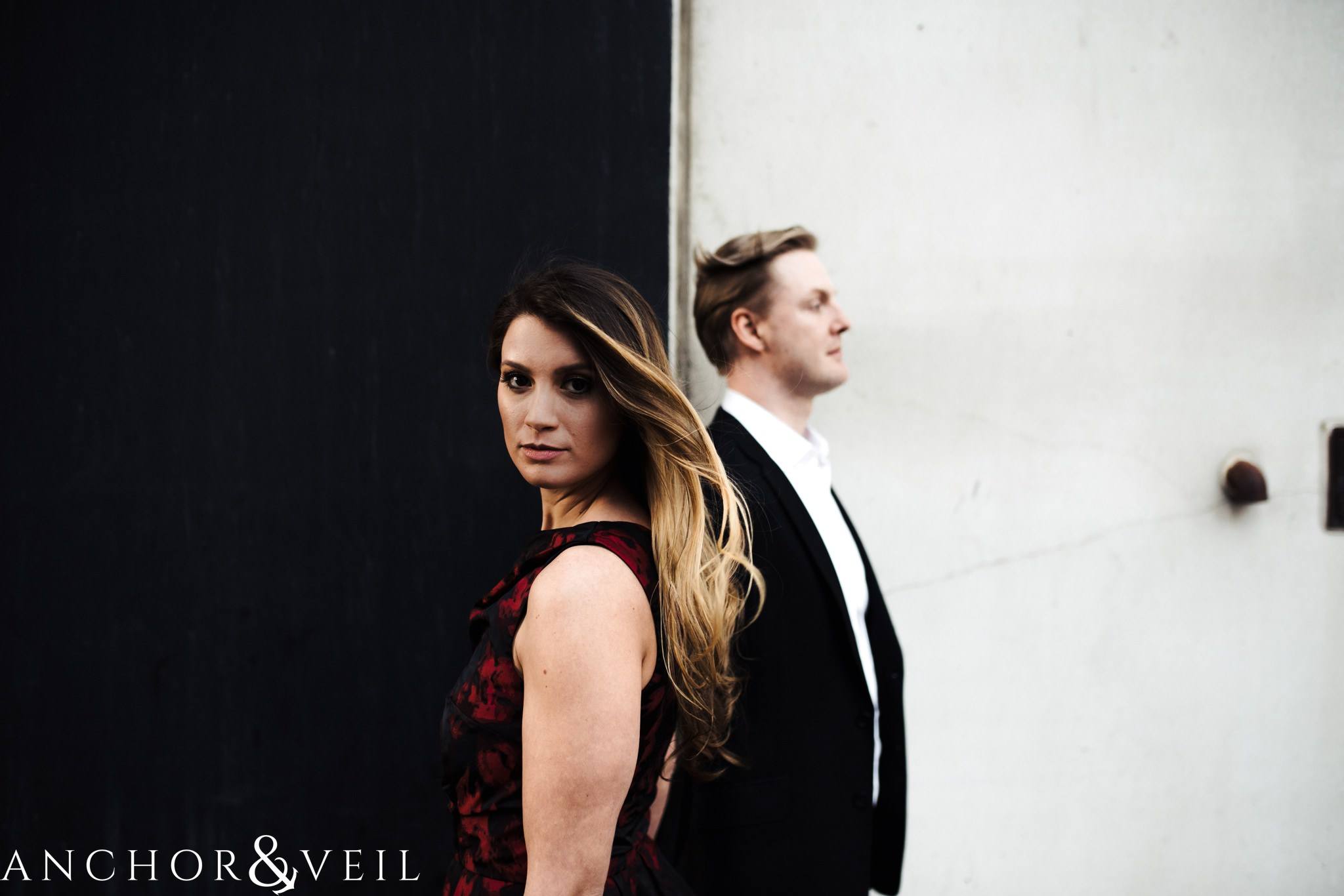 black and white walls during their uptown Charlotte engagement session