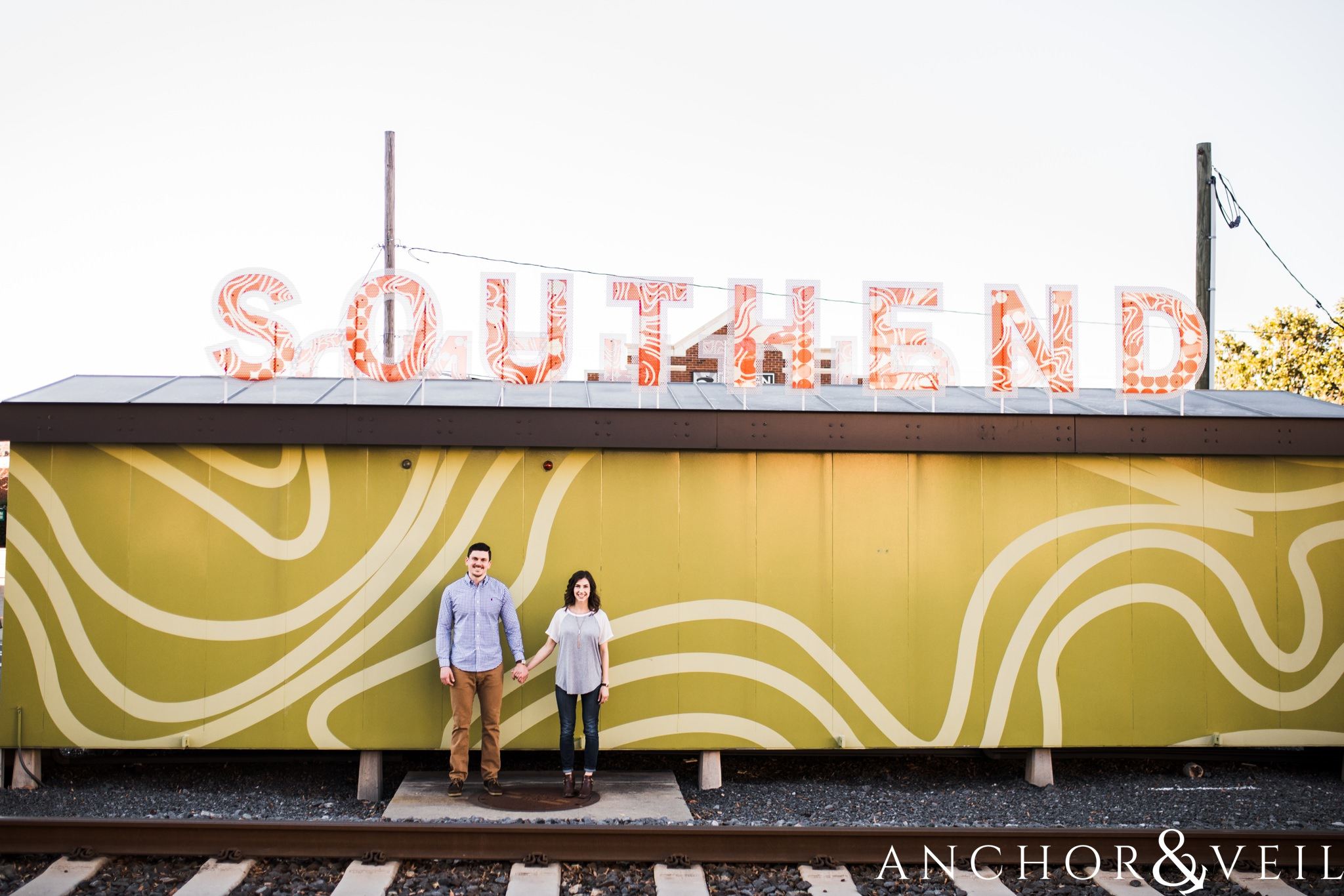 southend sign during their southend Charlotte and Jetton park engagement session