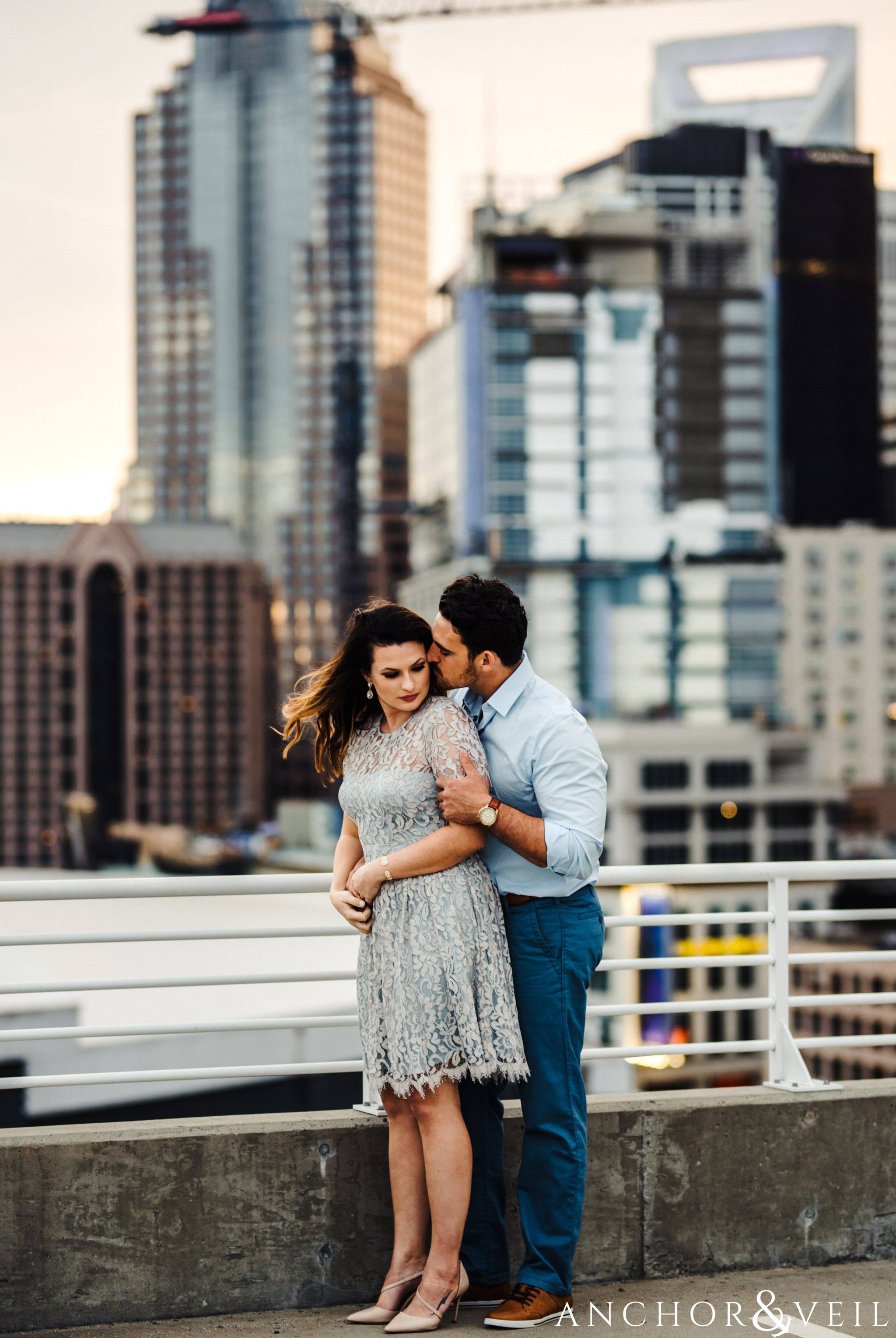 Charlotte uptown skyline during their Uptown Charlotte NC Engagement Session